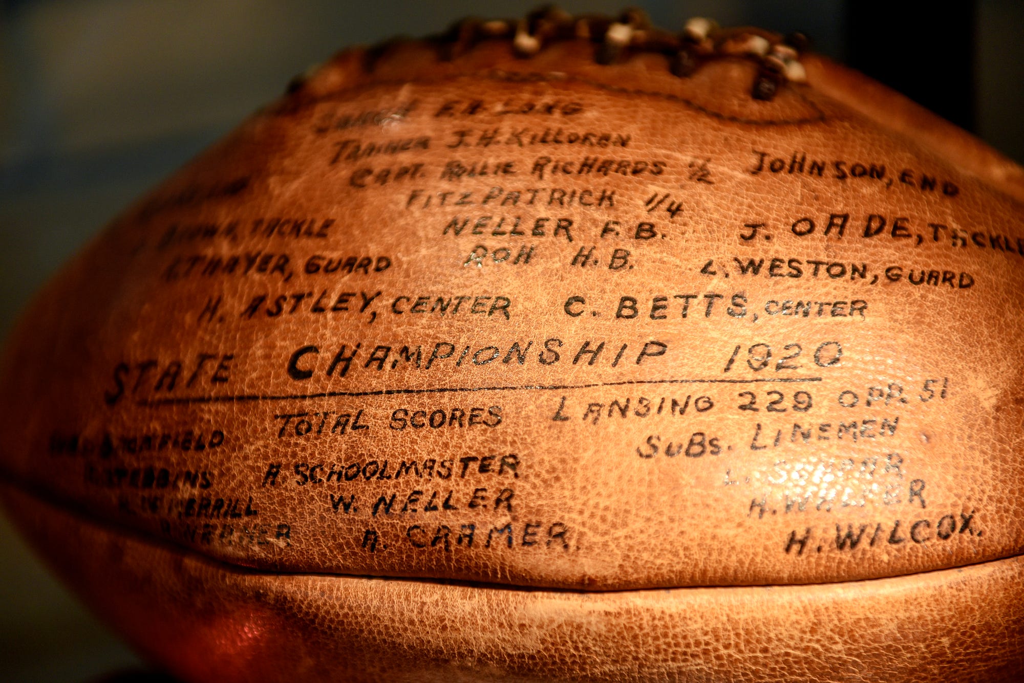 The football from the 1920 Lansing Central High School football championship team is on display before the start of the Greater Lansing Area Sports Hall of Fame Induction Ceremony on Thursday, July 25, 2019, at the Lansing Center. The team included past inductees Harry Kipke, Dave Brown and James Oade.