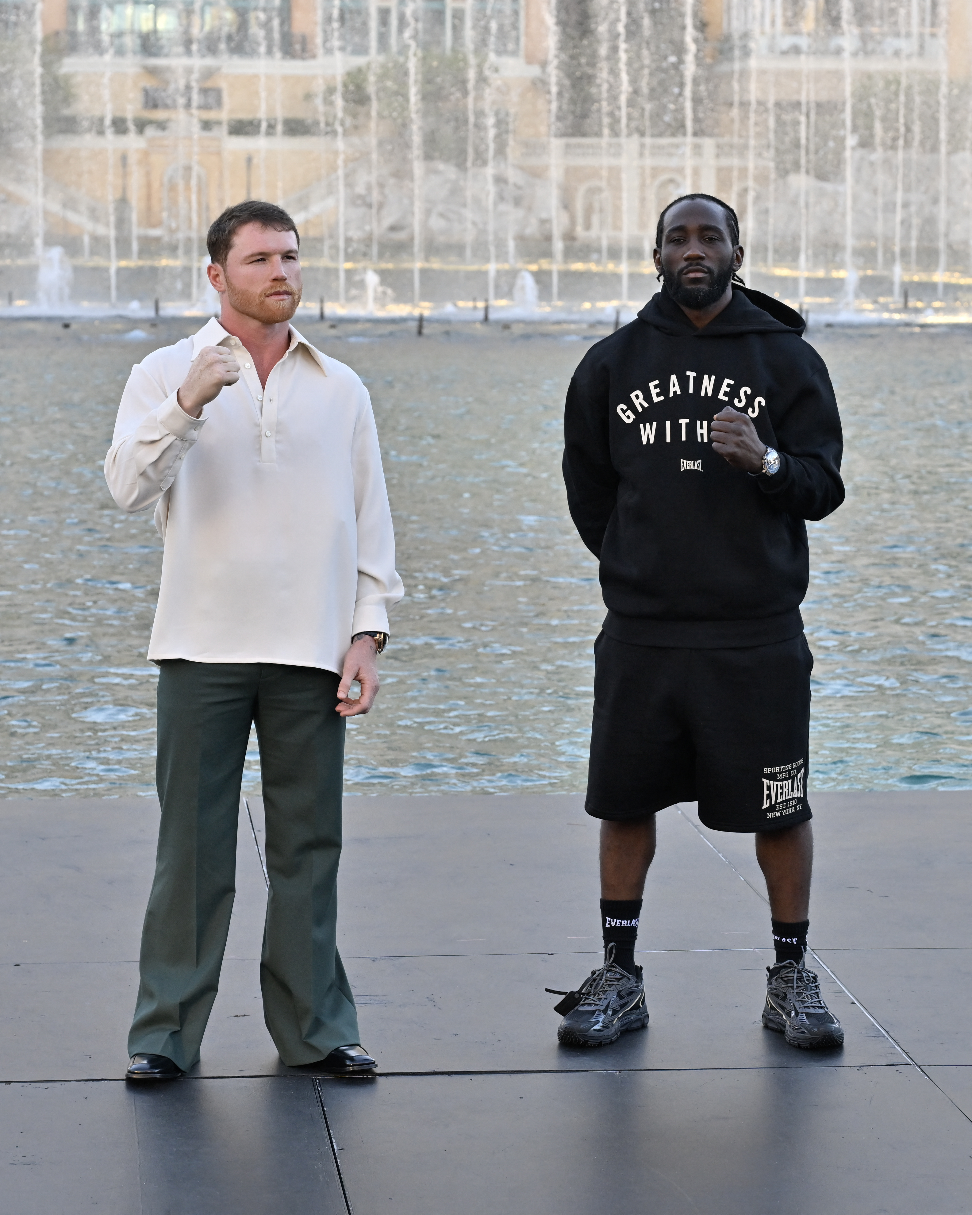LAS VEGAS, NEVADA - SEPTEMBER 08: (L-R) Canelo Alvarez and Terence Crawford pose for a photo after facing off during Netflix's Canelo vs Crawford Faceoff at The Fountains of Bellagio on September 08, 2025 in Las Vegas, Nevada. David Becker/Getty Images for Netflix/AFP (Photo by David Becker / GETTY IMAGES NORTH AMERICA / Getty Images via AFP)