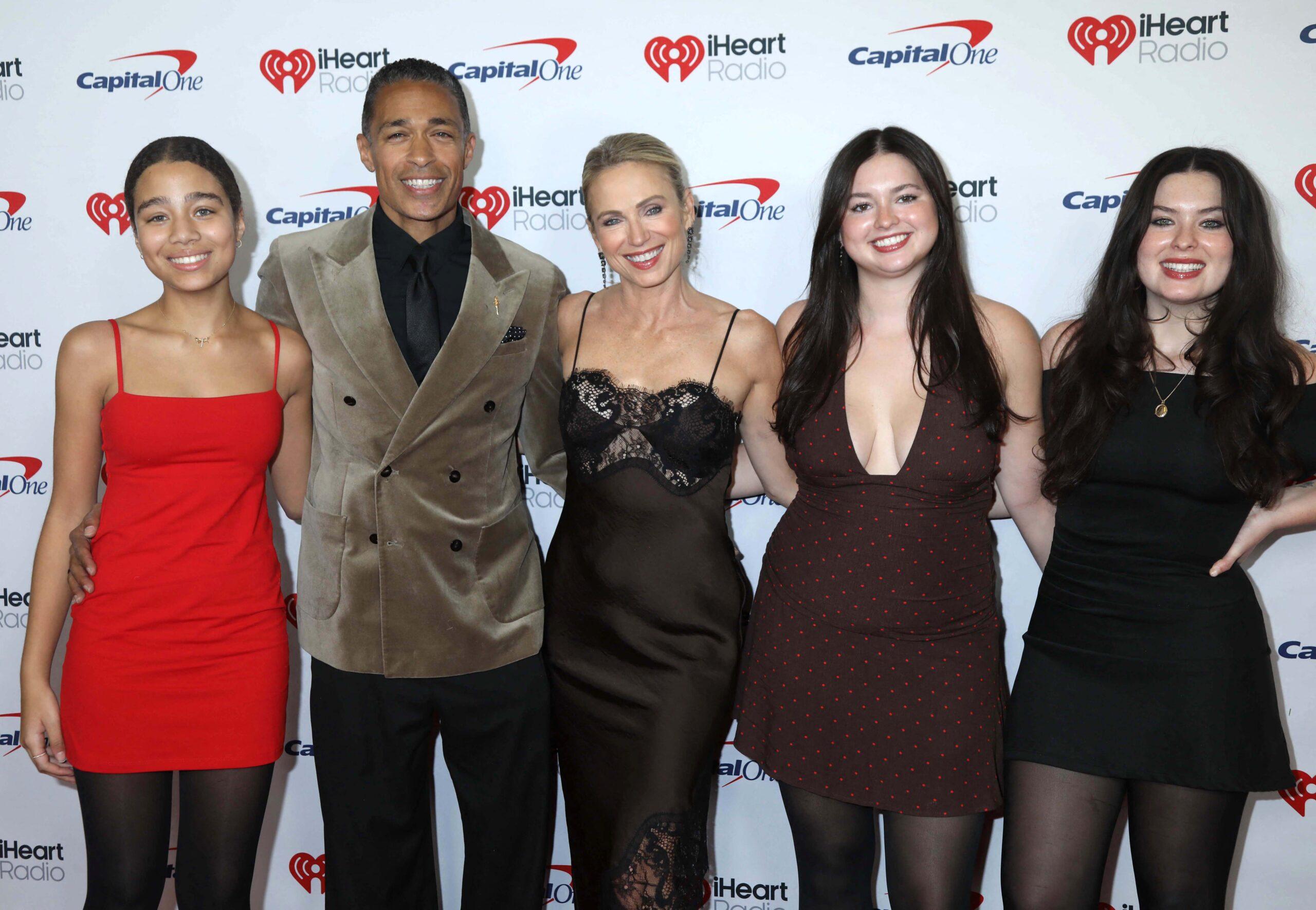 T.J. Holmes and Amy Robach and their family