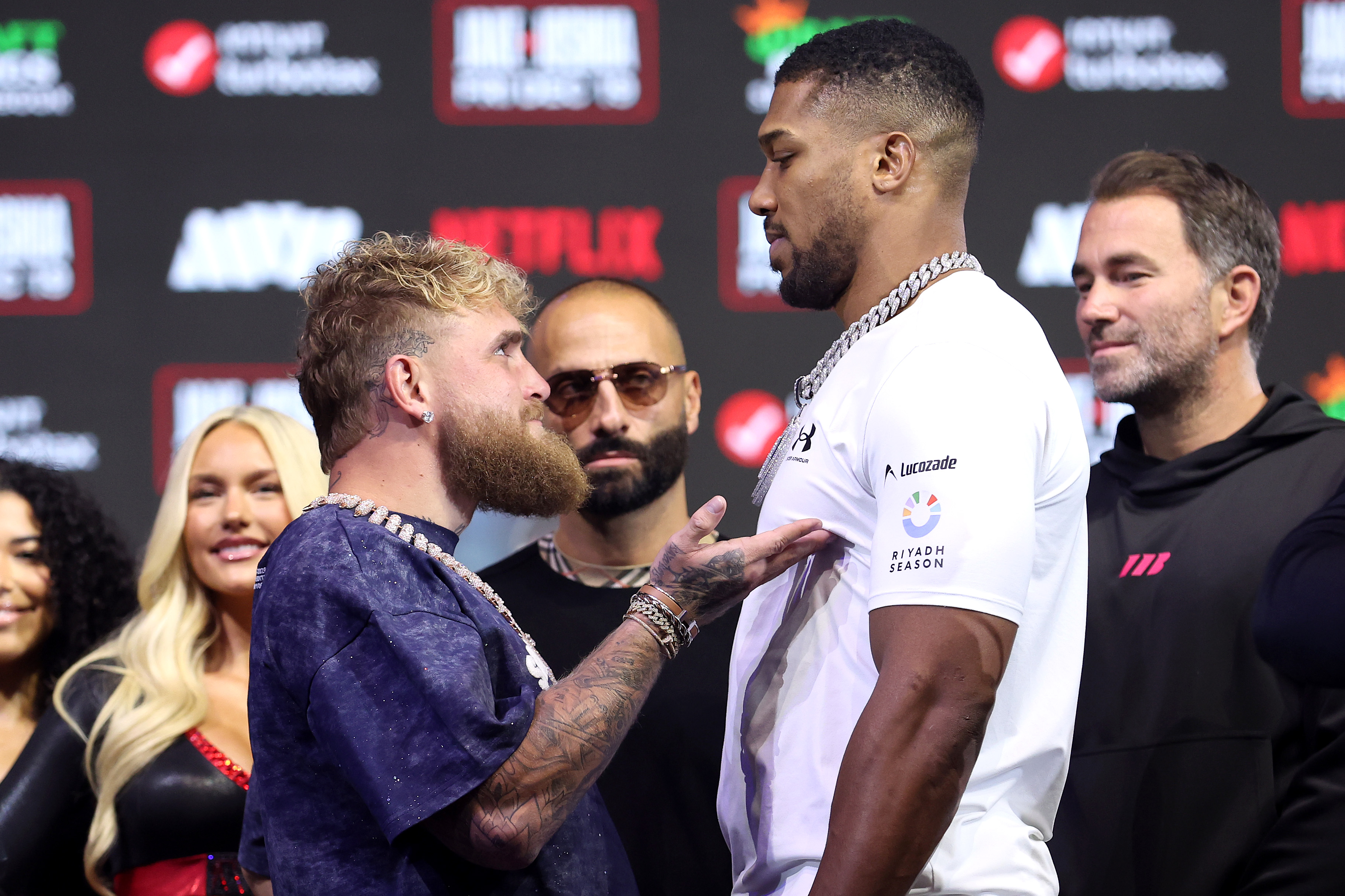 MIAMI BEACH, FLORIDA - DECEMBER 17: (L-R) Jake Paul and Anthony Joshua face off during the press conference for Jake Paul v Anthony Joshua at The Fillmore Miami Beach on December 17, 2025 in Miami Beach, Florida. (Photo by Megan Briggs/Getty Images for Netflix)