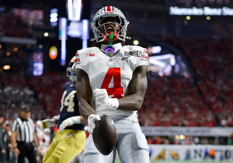 ATLANTA, GEORGIA - JANUARY 20: Jeremiah Smith #4 of the Ohio State Buckeyes celebrates after scoring a touchdown against the Notre Dame Fighting Irish during the second quarter in the 2025 CFP National Championship at the Mercedes-Benz Stadium on January 20, 2025 in Atlanta, Georgia. (Photo by Todd Kirkland/Getty Images)