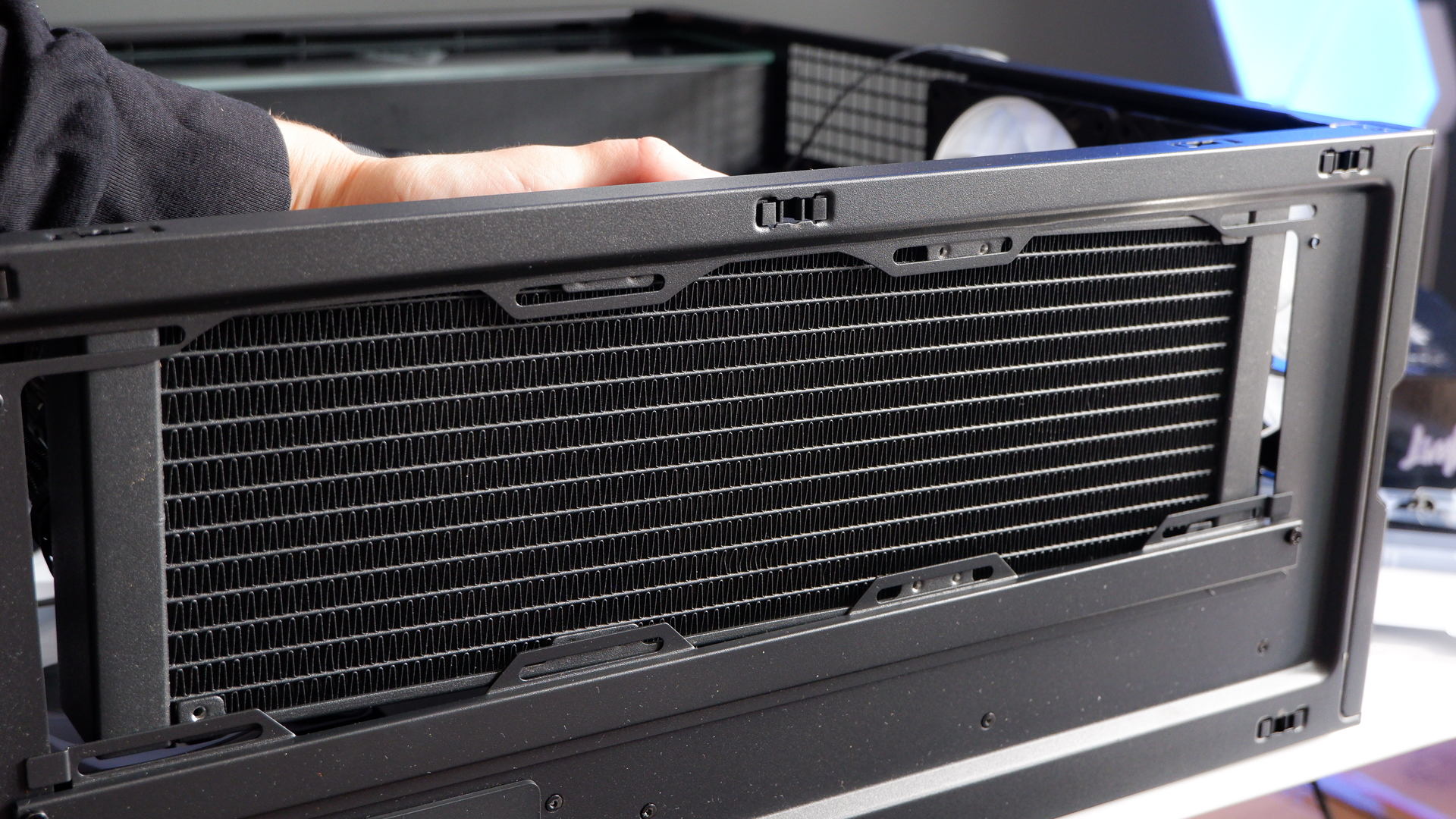 Arctic's Xtender PC case on a white desk with various parts being installed to build a functional gaming PC.