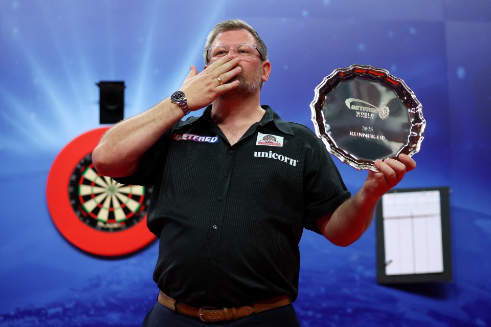 BLACKPOOL, ENGLAND - JULY 27: James Wade of England poses with his Runners Up plate after defeat in the Final match between James Wade of England and Luke Littler of England on day nine of the 2025 Betfred World Matchplay at Winter Gardens on July 27, 2025 in Blackpool, England. (Photo by Lewis Storey/Getty Images)