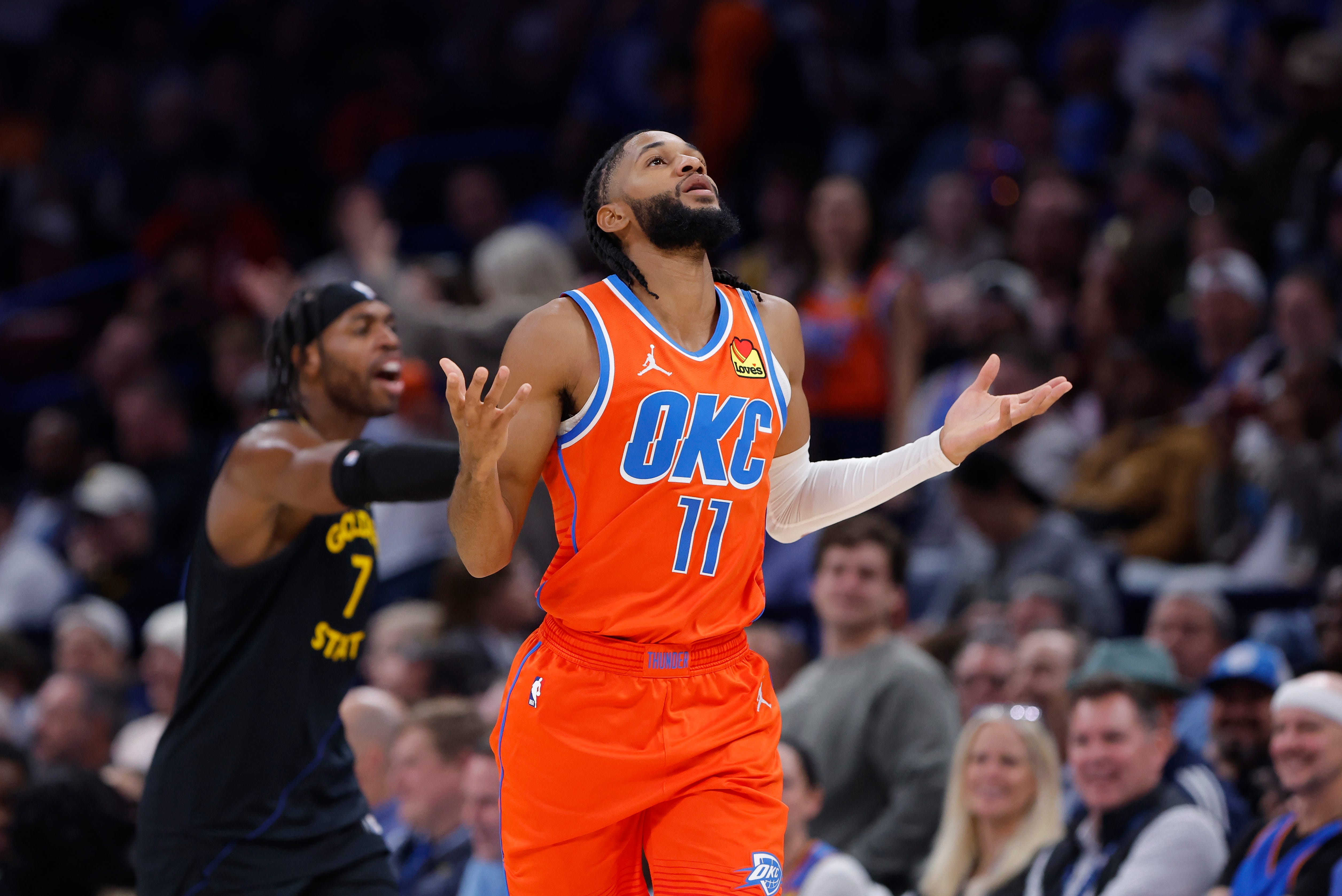 Nov 11, 2025; Oklahoma City, Oklahoma, USA; Oklahoma City Thunder guard Isaiah Joe (11) gestures after scoring against the Golden State Warriors during the second half at Paycom Center. Mandatory Credit: Alonzo Adams-Imagn Images