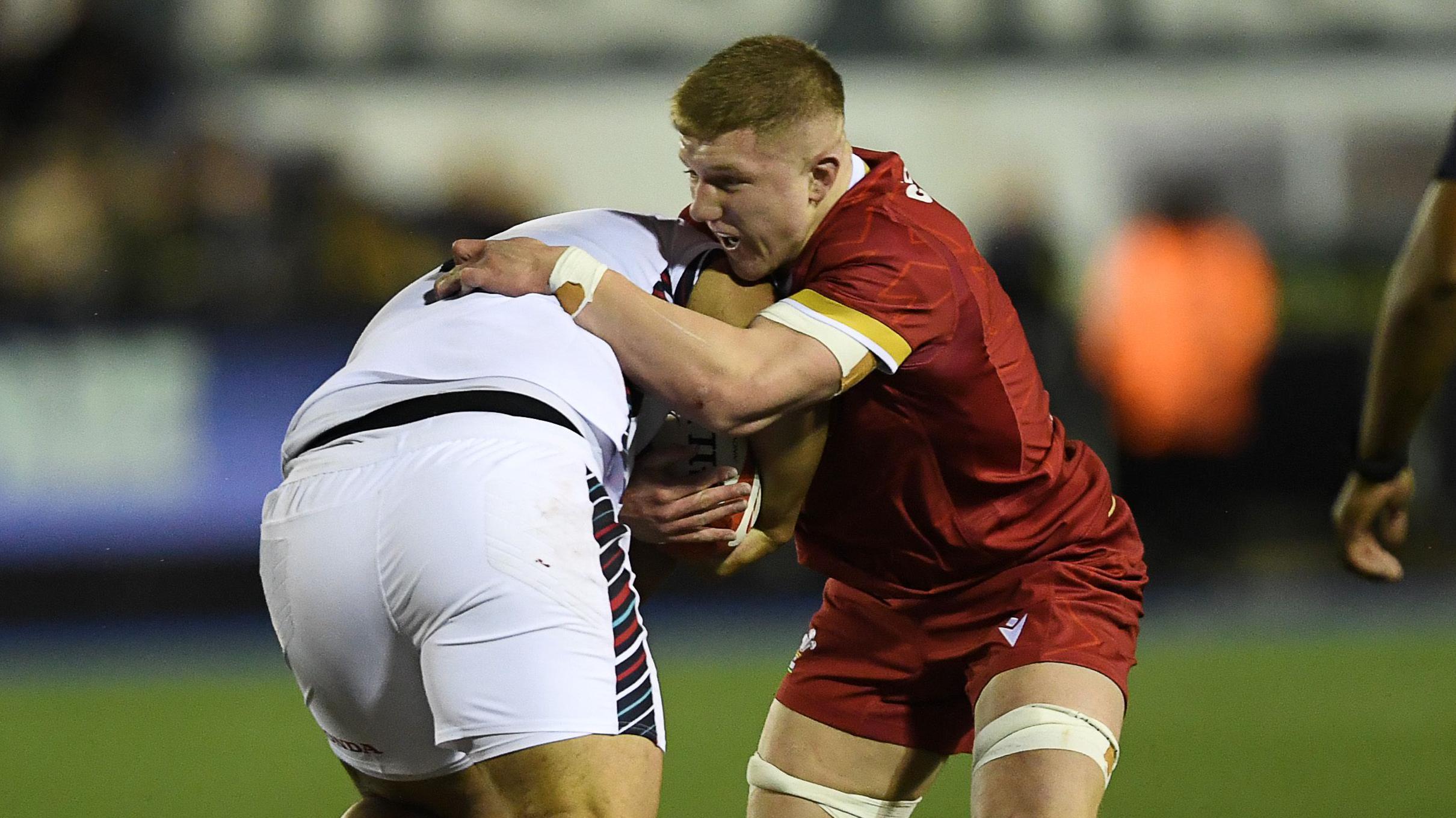 Wales Under-20s captain Harry Beddall makes a tackle against England
