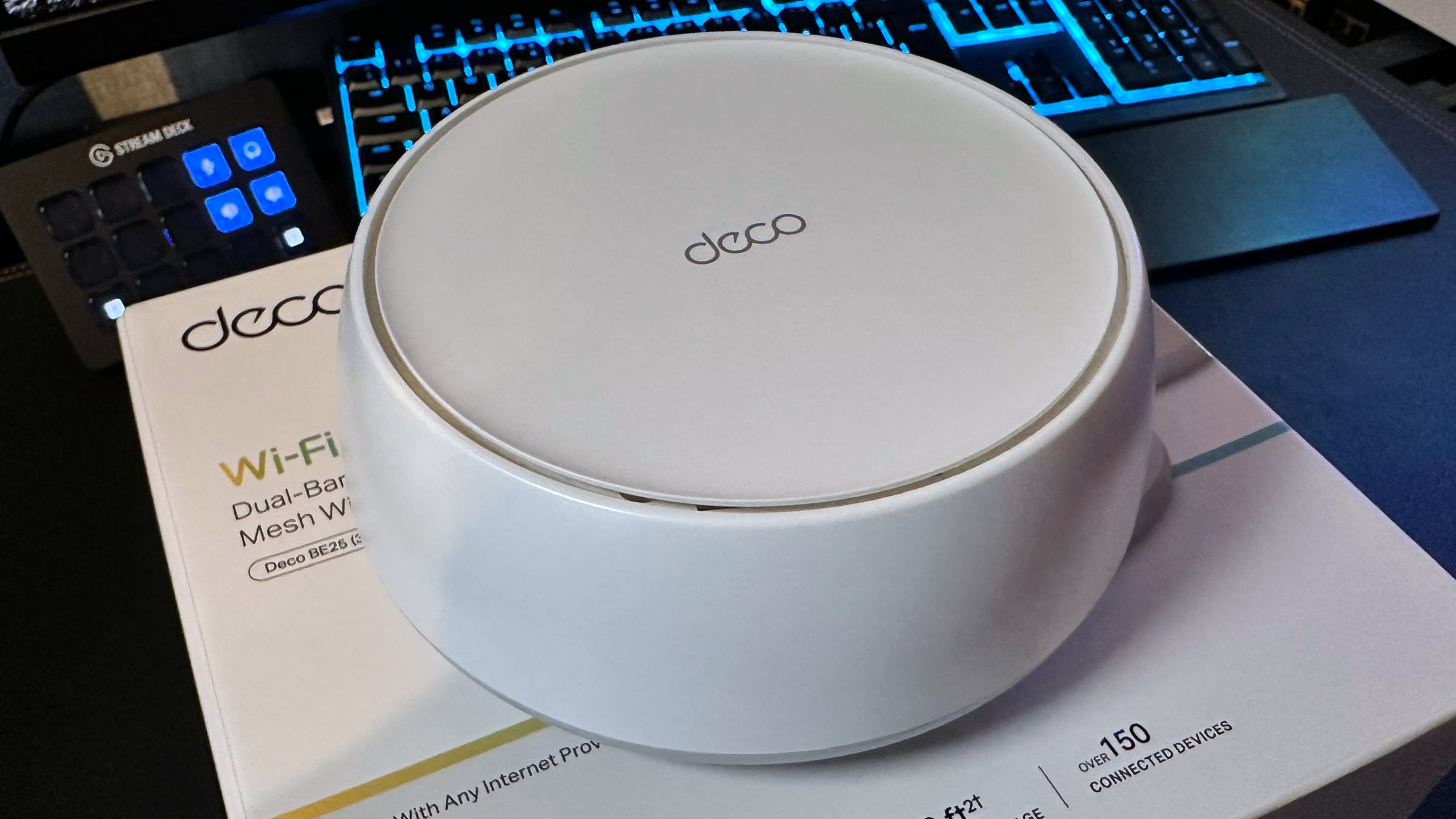 A photo of a TP-Link Deco BE25 mesh router.