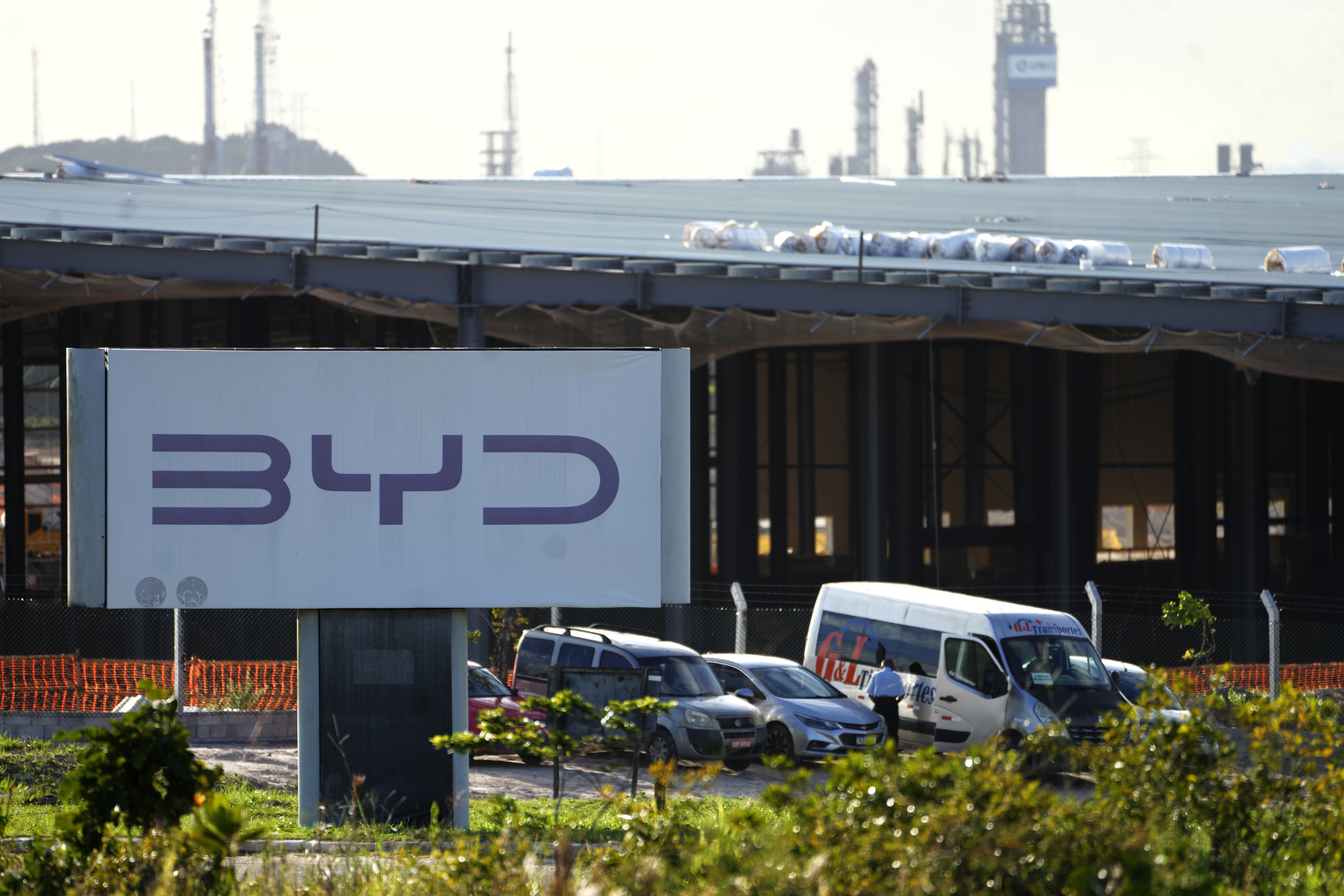 A sign for BYD is displayed near a factory under construction in Camacari, Bahia state, Brazil, Thursday, March 6, 2025. (AP Photo/Eraldo Peres)