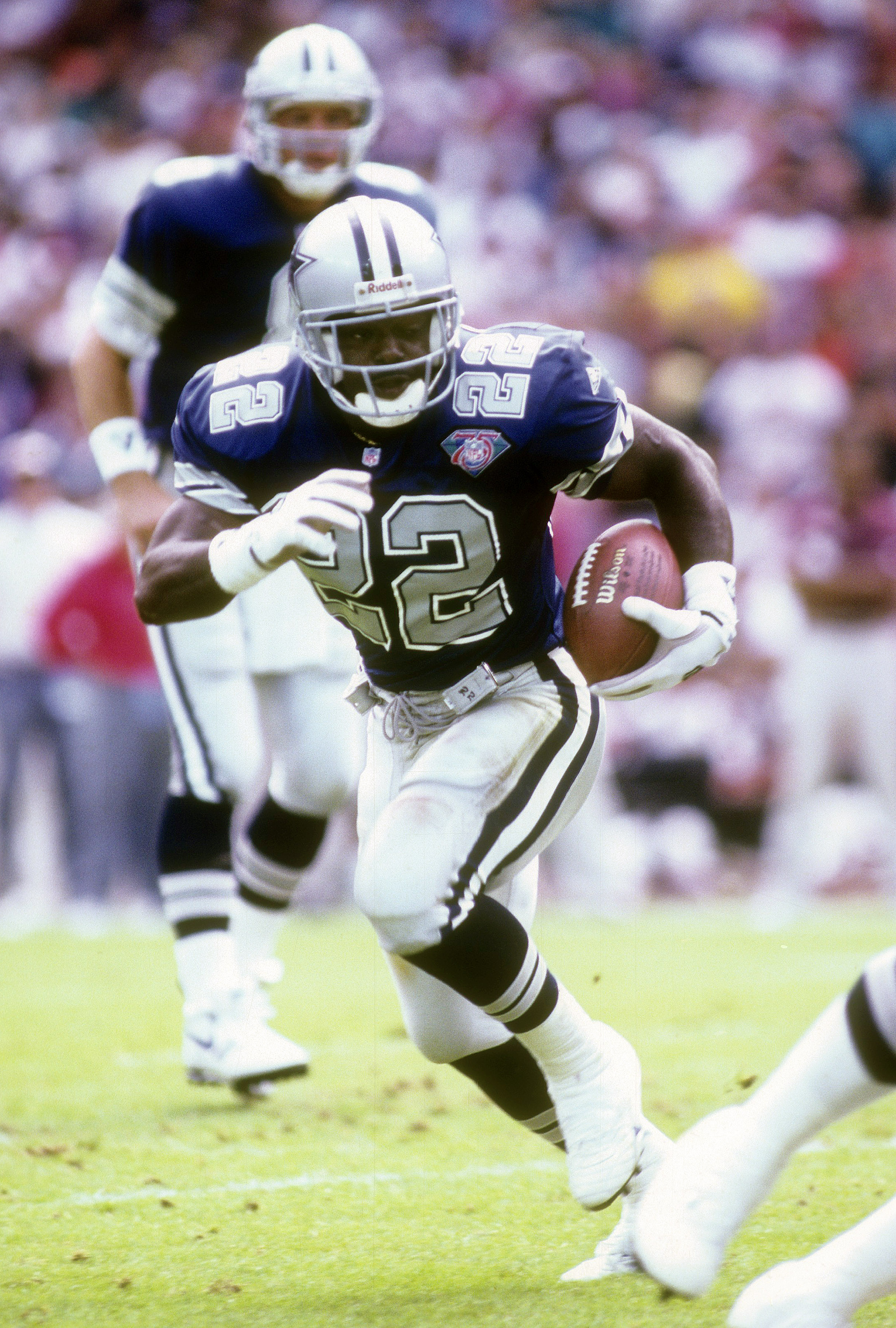 WASHINGTON, D.C. - OCTOBER 2: Running Back Emmitt Smith #22 of the Dallas Cowboys carries the ball against the Washington Redskins October 2, 1994 during an NFL football game at RFK Stadium in Washington, D.C. Smith played for the Cowboys from 1990-02. (Photo by Focus on Sport/Getty Images)
