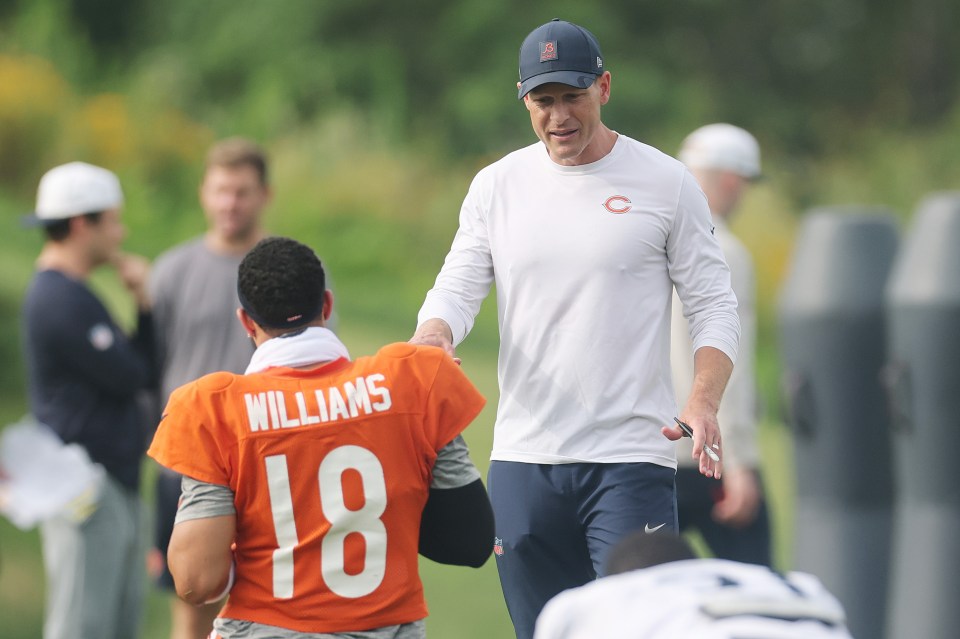 LAKE FOREST, ILLINOIS - JULY 28: Head coach Ben Johnson of the Chicago Bears talks with Caleb Williams #18 during Chicago Bears Training Camp at Halas Hall on July 28, 2025 in Lake Forest, Illinois. (Photo by Michael Reaves/Getty Images)