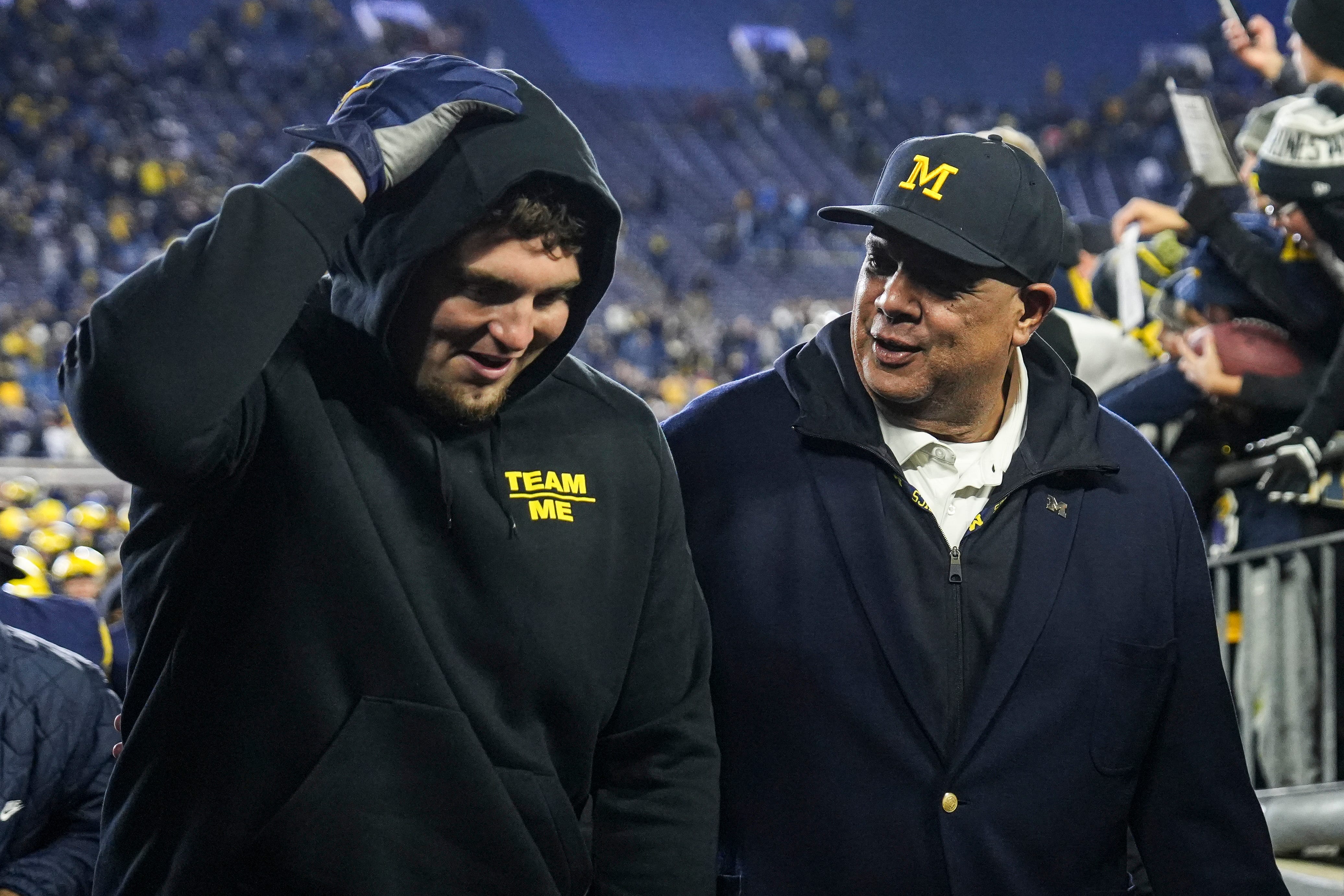 Michigan athletic director Warde Manuel talks to former player Mason Graham after 21-16 win over Purdue at Michigan Stadium in Ann Arbor on Saturday, November 1, 2025.
