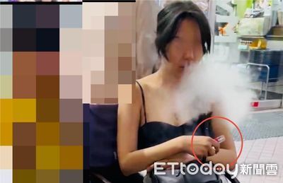 暴乳低胸妹躺路中警上前關心！她掏煙彈狂吸　鼻子噴出2管濃煙