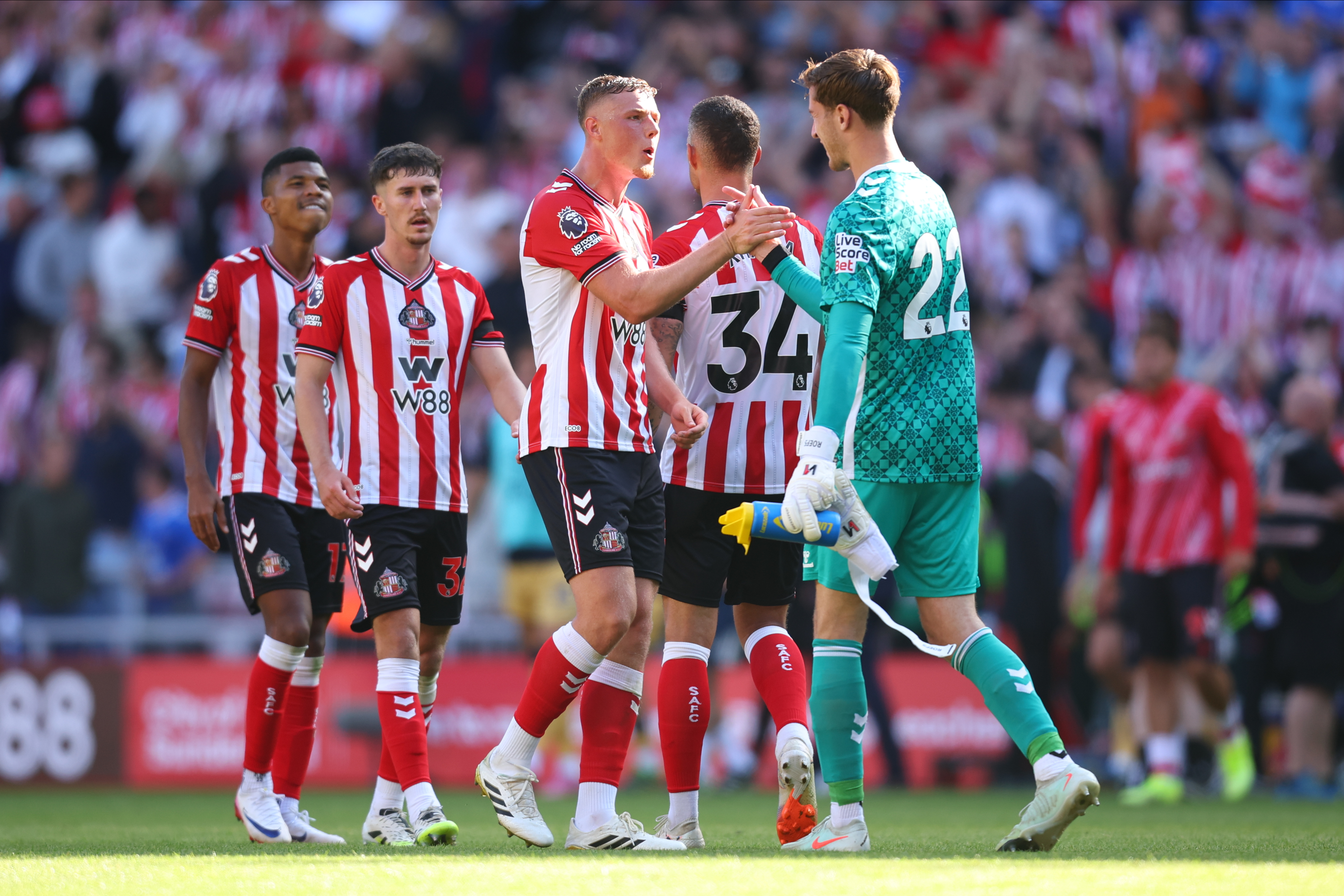 SUNDERLAND, ENGLAND - AUGUST 16: Dan Ballard of Sunderland and Robin Roefs, goalkeeper of Sunderland celebrate after winning the Premier League match between Sunderland and West Ham United at Stadium of Light on August 16, 2025 in Sunderland, England. (Photo by Ed Sykes/Sportsphoto/Allstar Via Getty Images)