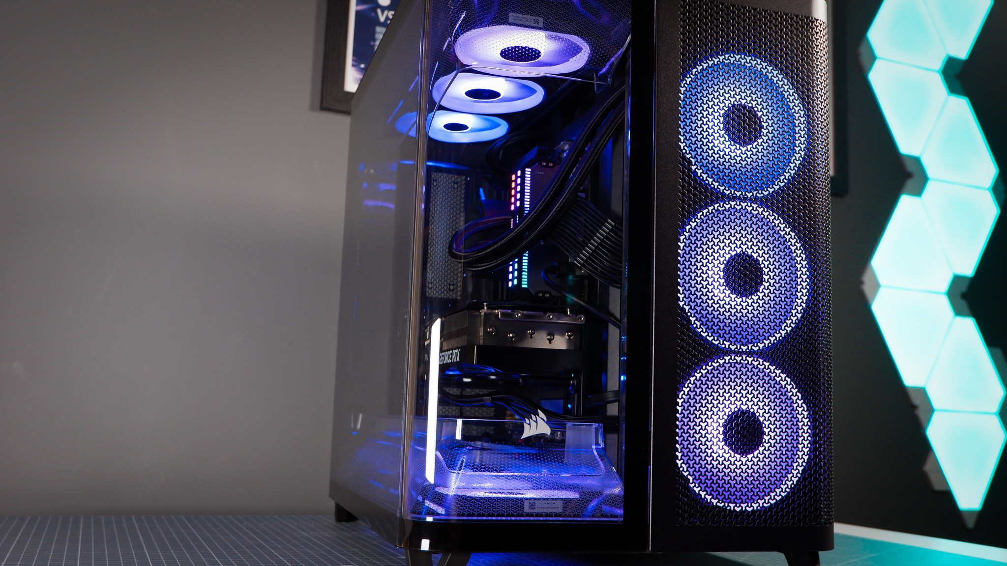 A Corsair Air 5400 PC case on a desk with various parts installed.