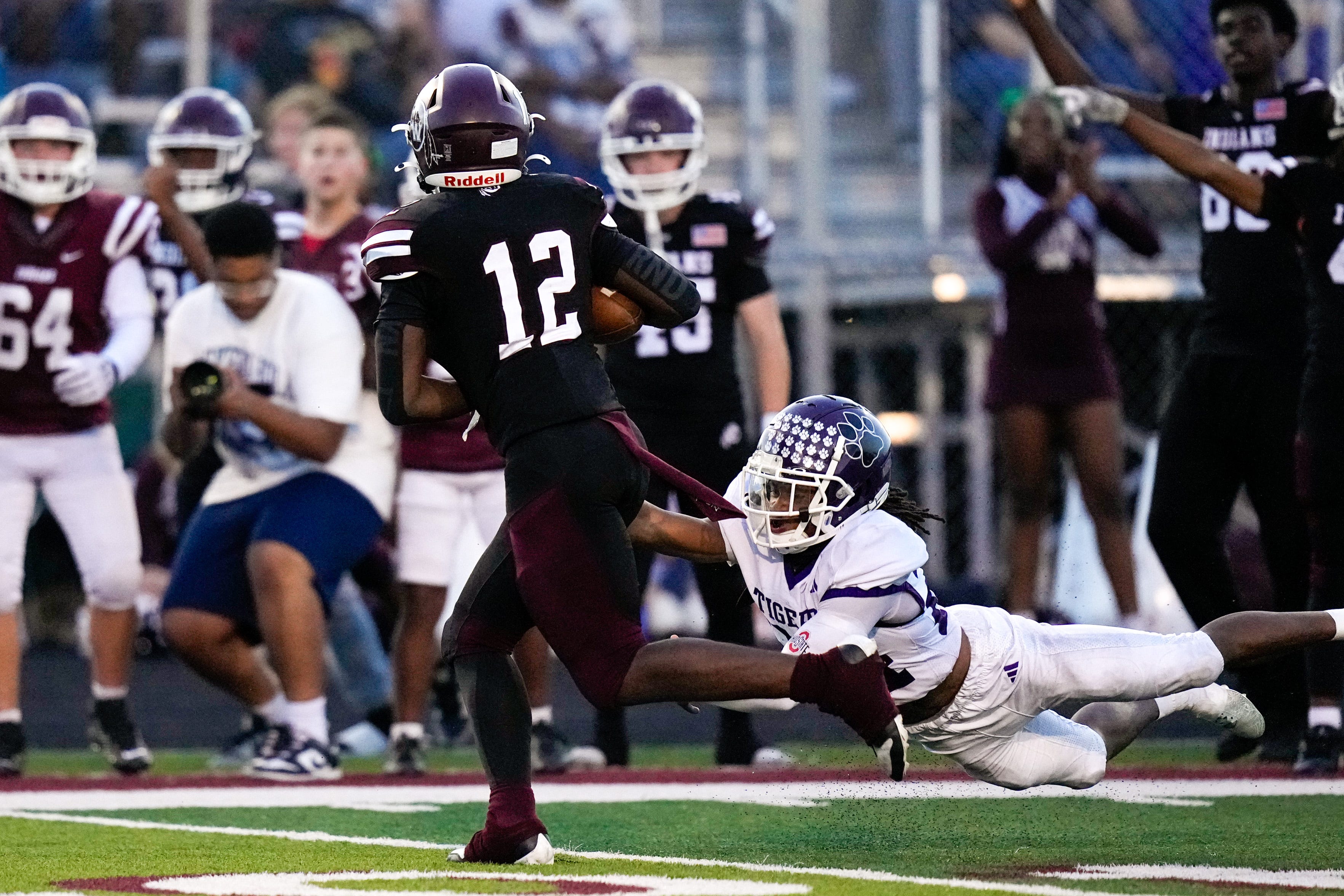 Players from Canal Winchester and Pickerington Central will participate in the Highway 33 Showcase for college coaches on May 6 at Central. Here, Canal running back Jamari Snow (12) tries to evade Central's Jordan Sanders III during their September 2025 game.