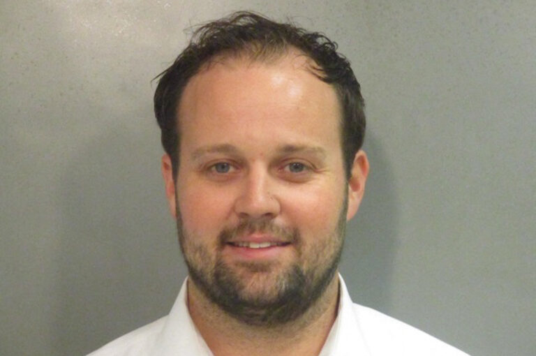 Josh Duggar smiles in new mugshot photograph after being found guilty in child pornography case