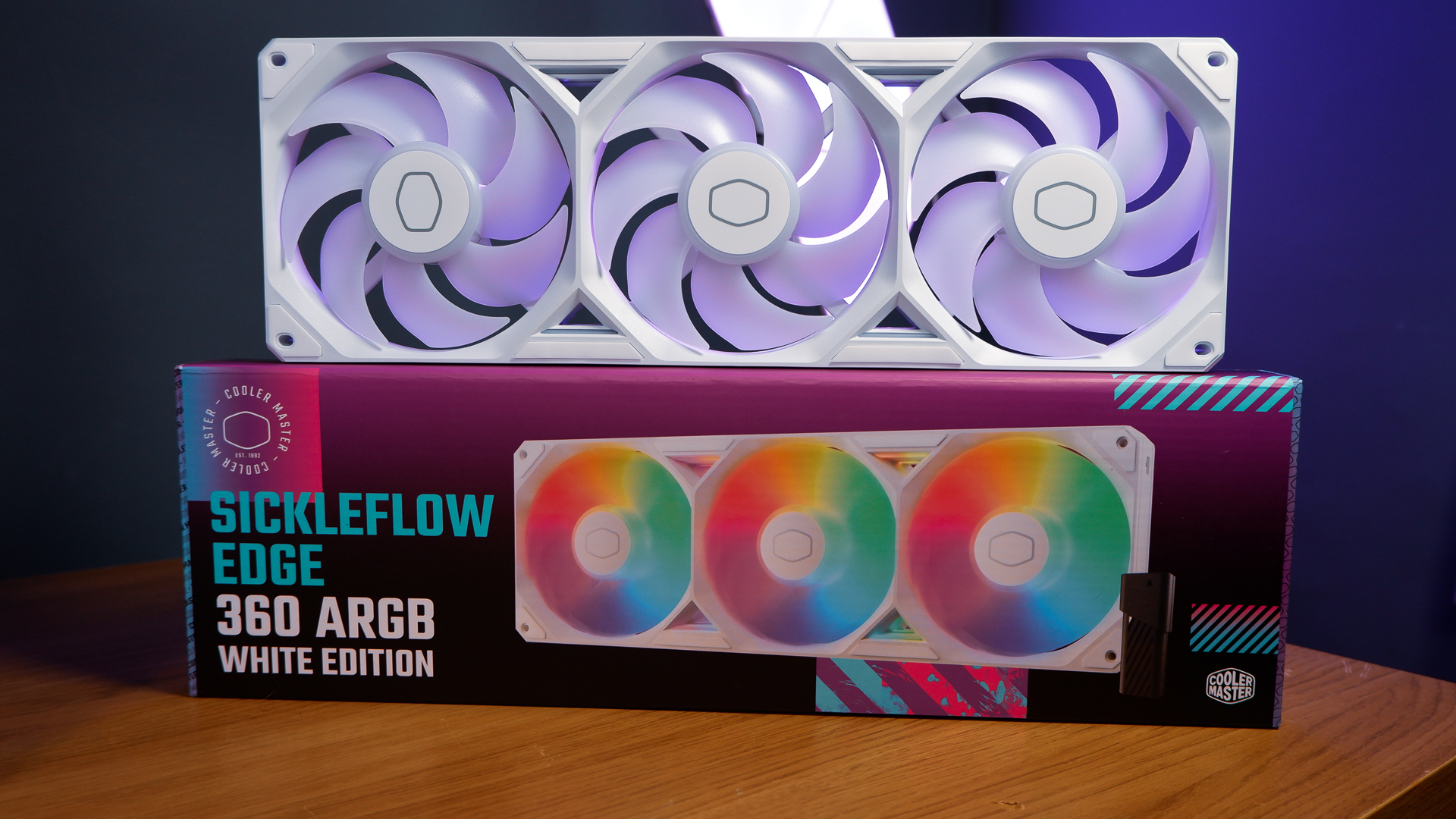 A white gaming PC built using a Thermaltake PC case, Cooler Master fans, and an AMD CPU.