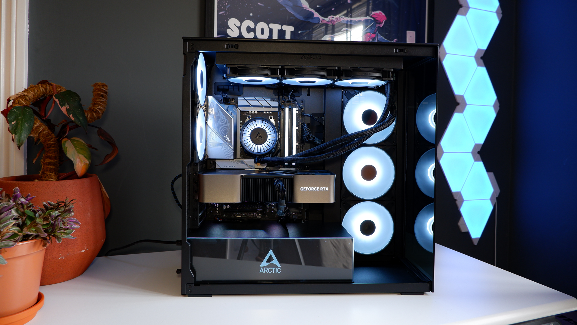 Arctic's Xtender PC case on a white desk with various parts being installed to build a functional gaming PC.