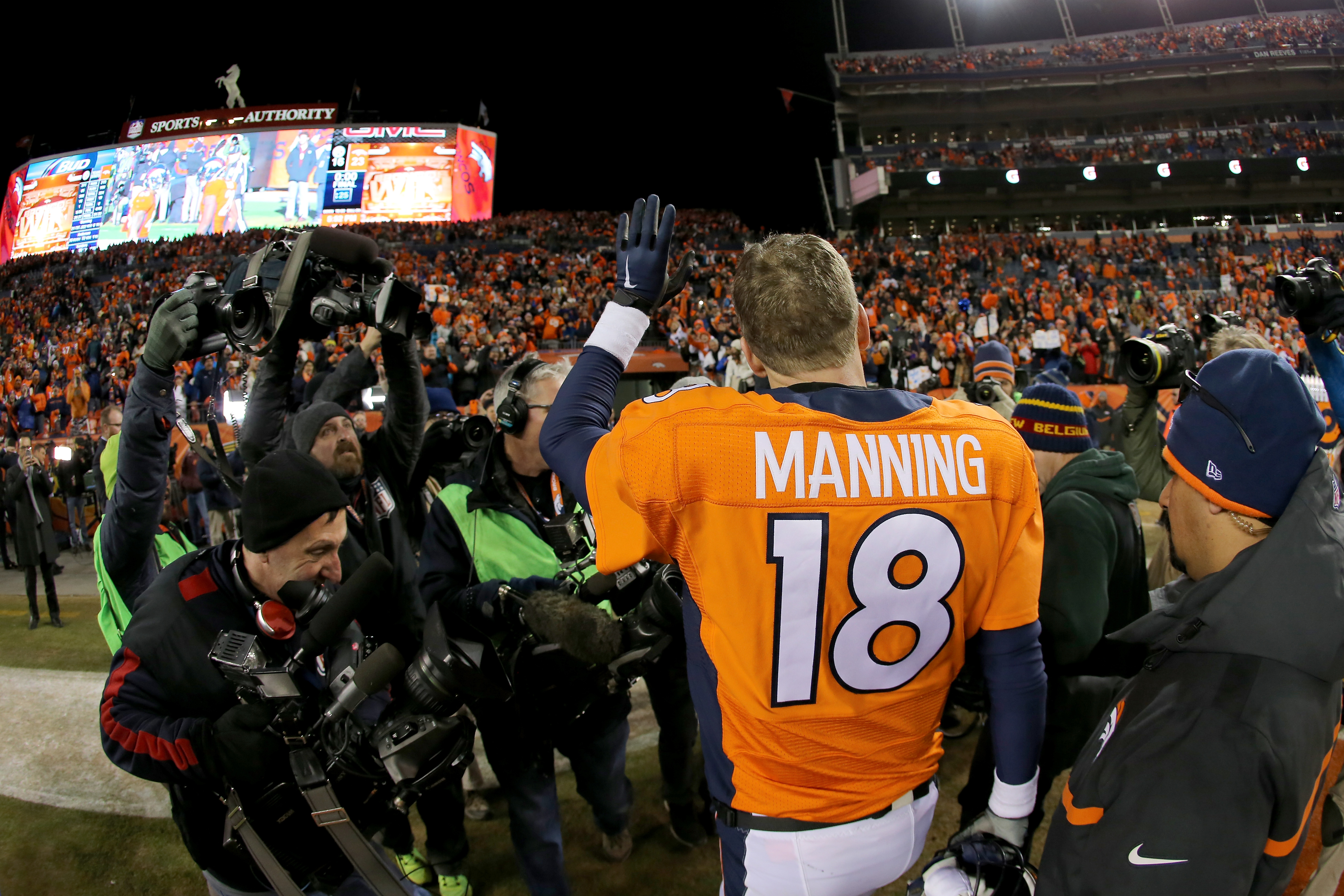 DENVER, CO - JANUARY 17: Peyton Manning #18 of the Denver Broncos waves to fans as he walks off the field after the AFC Divisional Playoff Game against the Pittsburgh Steelers at Sports Authority Field at Mile High on January 17, 2016 in Denver, Colorado. The Denver Broncos beat the Pittsburgh Steelers 23-16. (Photo by Doug Pensinger/Getty Images)