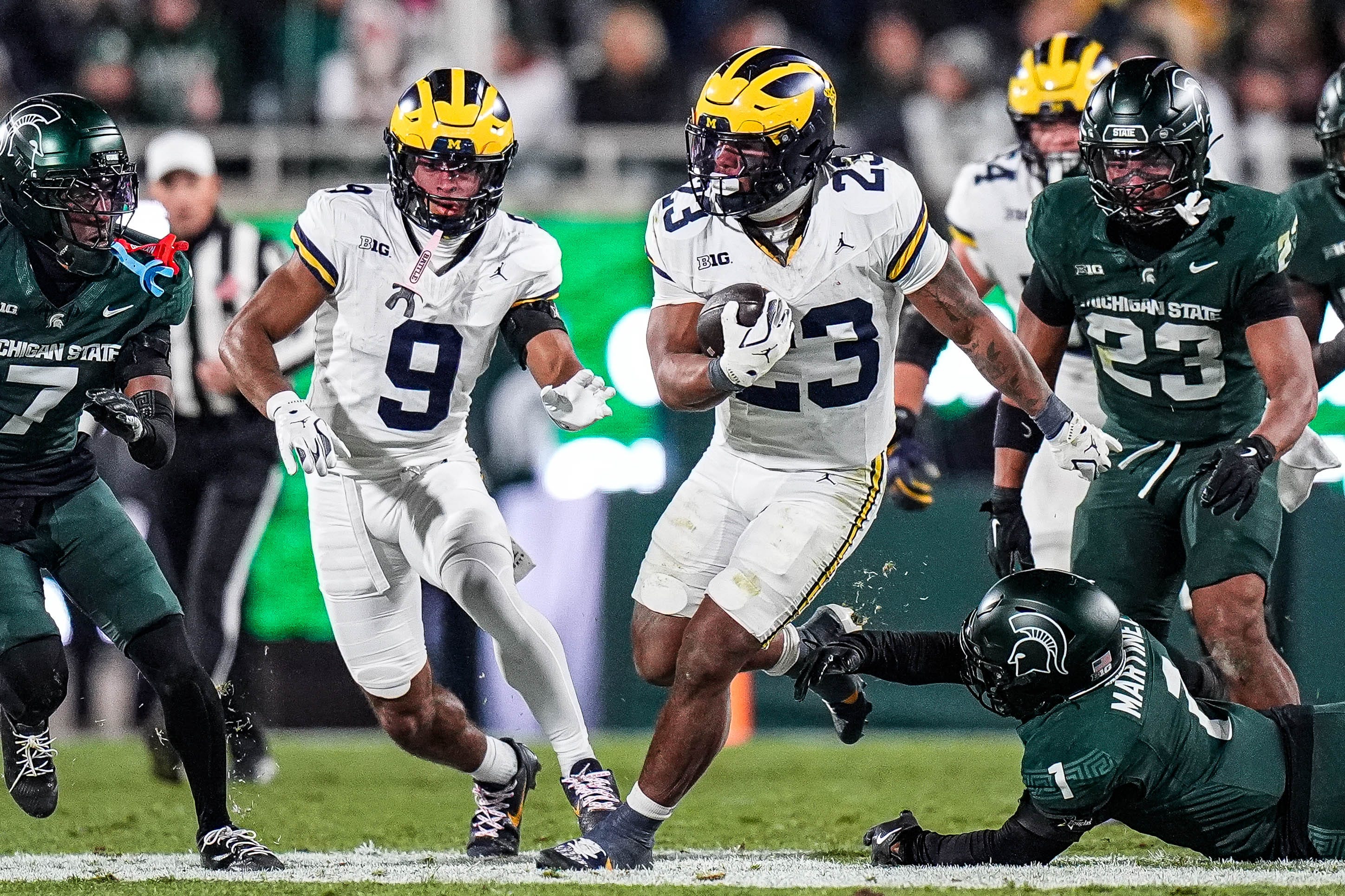 Michigan running back Jordan Marshall (23) runs against Michigan State during the second half at Spartan Stadium in East Lansing on Saturday, October 25, 2025.