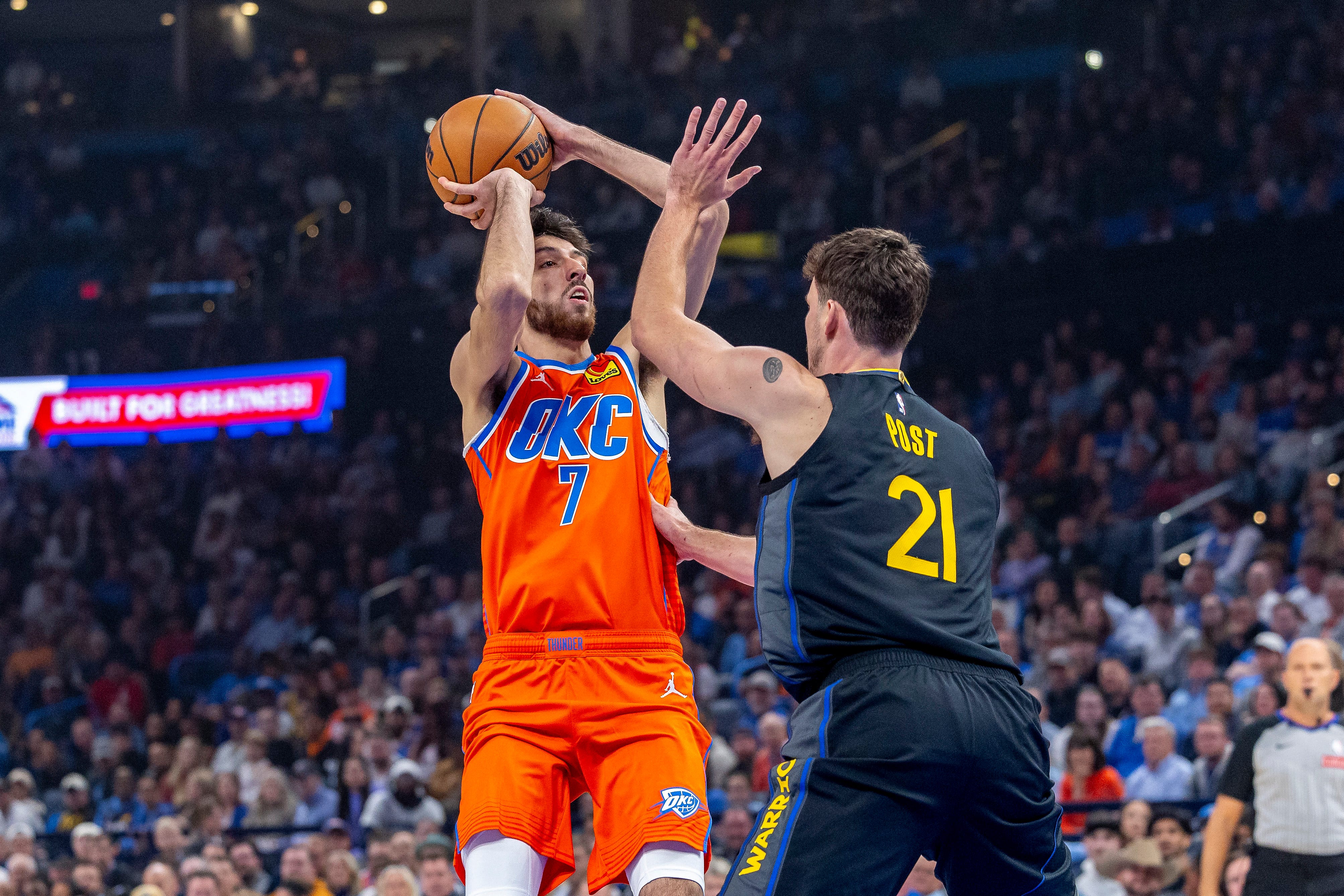 Nov 11, 2025; Oklahoma City, Oklahoma, USA; Oklahoma City Thunder center Chet Holmgren (7) shoots over Golden State Warriors center Quinten Post (21) during the first quarter at Paycom Center. Mandatory Credit: Alonzo Adams-Imagn Images