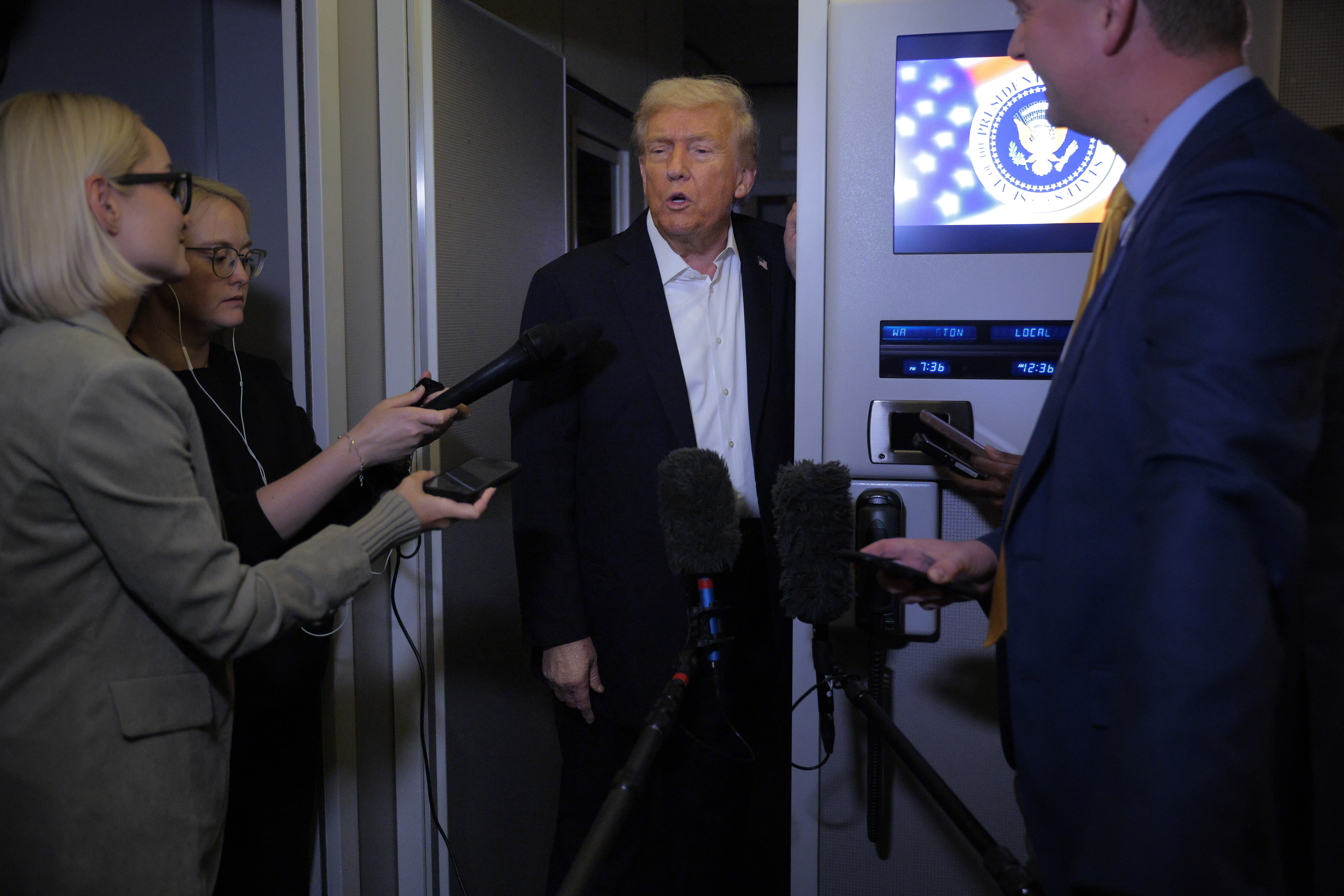 MINDENHALL, UNITED KINGDOM - OCTOBER 13: U.S. President Donald Trump talks with reporters during a refuel stop at the U.S. Air Force Base Mindenhall as he returns to Washington on October 13, 2025 in Mindenhall, United Kingdom. President Trump is visiting the country hours after Hamas released the remaining Israeli hostages captured on Oct. 7, 2023, part of a US-brokered ceasefire deal to end the war in the Gaza Strip. (Photo by Chip Somodevilla/Getty Images)