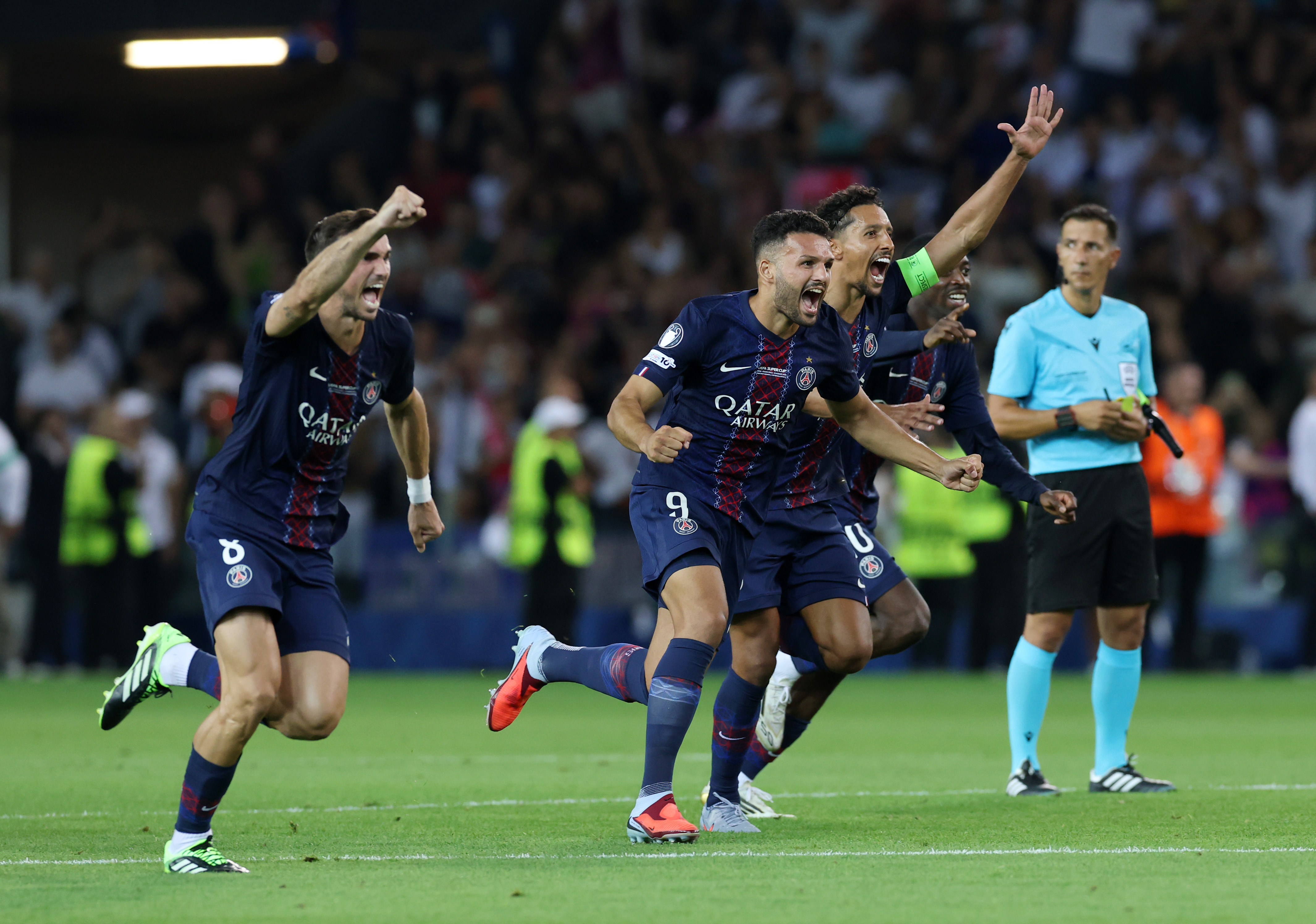 UDINE, ITALY - AUGUST 13: Goncalo Ramos and Marquinhos of Paris Saint-Germain celebrate after the team's victory in the penalty shoot out in the UEFA Super Cup 2025 match between Paris Saint-Germain and Tottenham Hotspur at Stadio Friuli on August 13, 2025 in Udine, Italy. (Photo by Claudio Villa/Getty Images)
