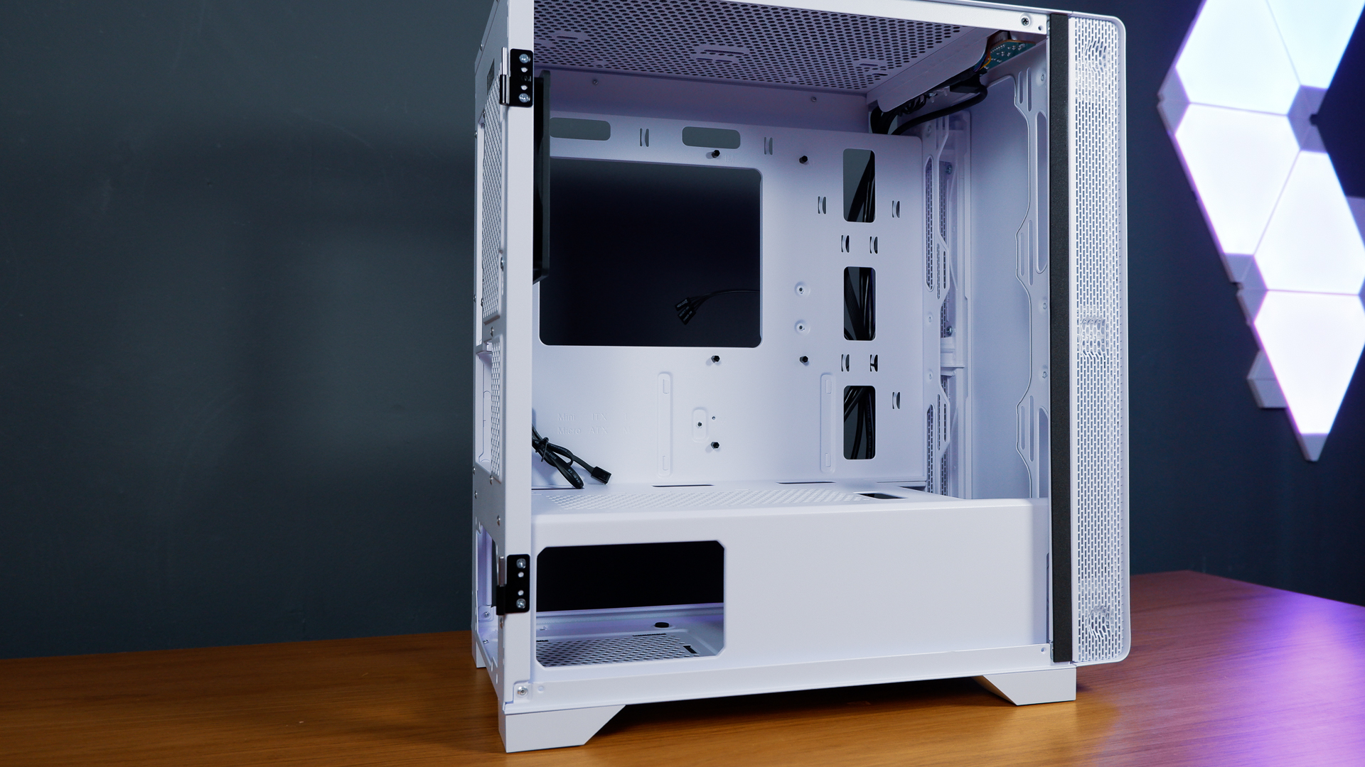A white gaming PC built using a Thermaltake PC case, Cooler Master fans, and an AMD CPU.