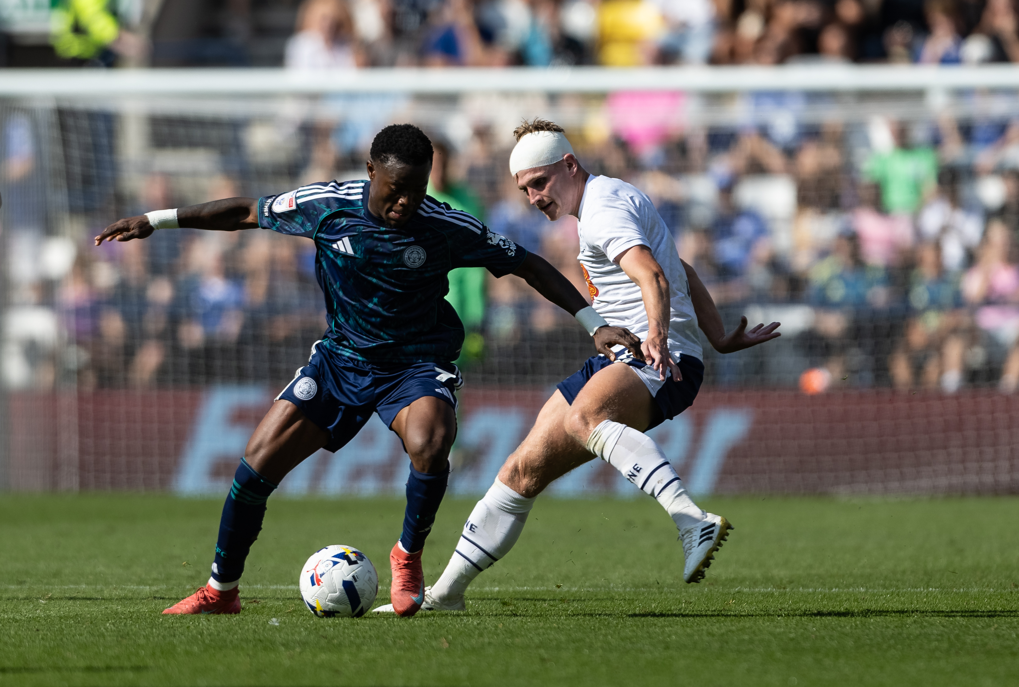 PRESTON, ENGLAND - AUGUST 16: Preston North End's Ali McCann competing with Leicester City's Abdul Fatawu (left) during the Sky Bet Championship match between Preston North End and Leicester City at Deepdale Stadium on August 16, 2025 in Preston, England. (Photo by Andrew Kearns - CameraSport via Getty Images)