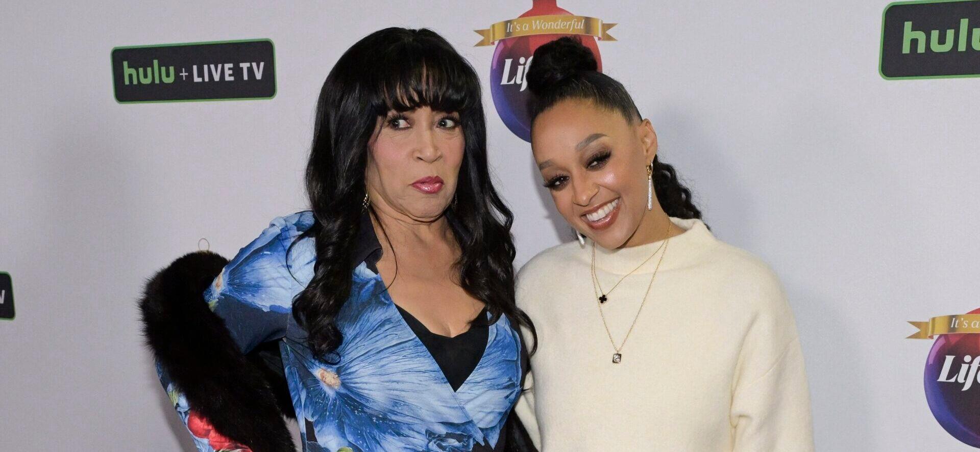 Jackée Harry posing with Tia Mowry on the red carpet.