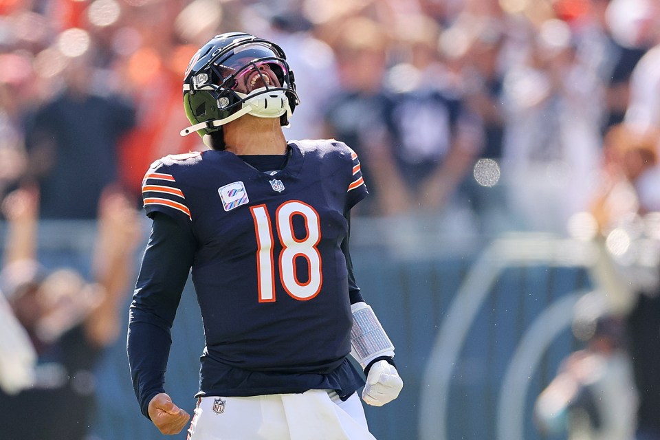 CHICAGO, ILLINOIS - OCTOBER 06: Caleb Williams #18 of the Chicago Bears reacts after throwing a touchdown pass to DJ Moore #2 (not pictured) against the Carolina Panthers during the second quarter at Soldier Field on October 06, 2024 in Chicago, Illinois. (Photo by Michael Reaves/Getty Images)