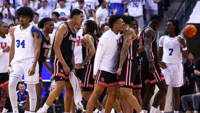 The Houston Cougars celebrate during a stoppage after scoring during game against BYU at the Marriott Center in Provo on Saturday, Feb. 7, 2026.