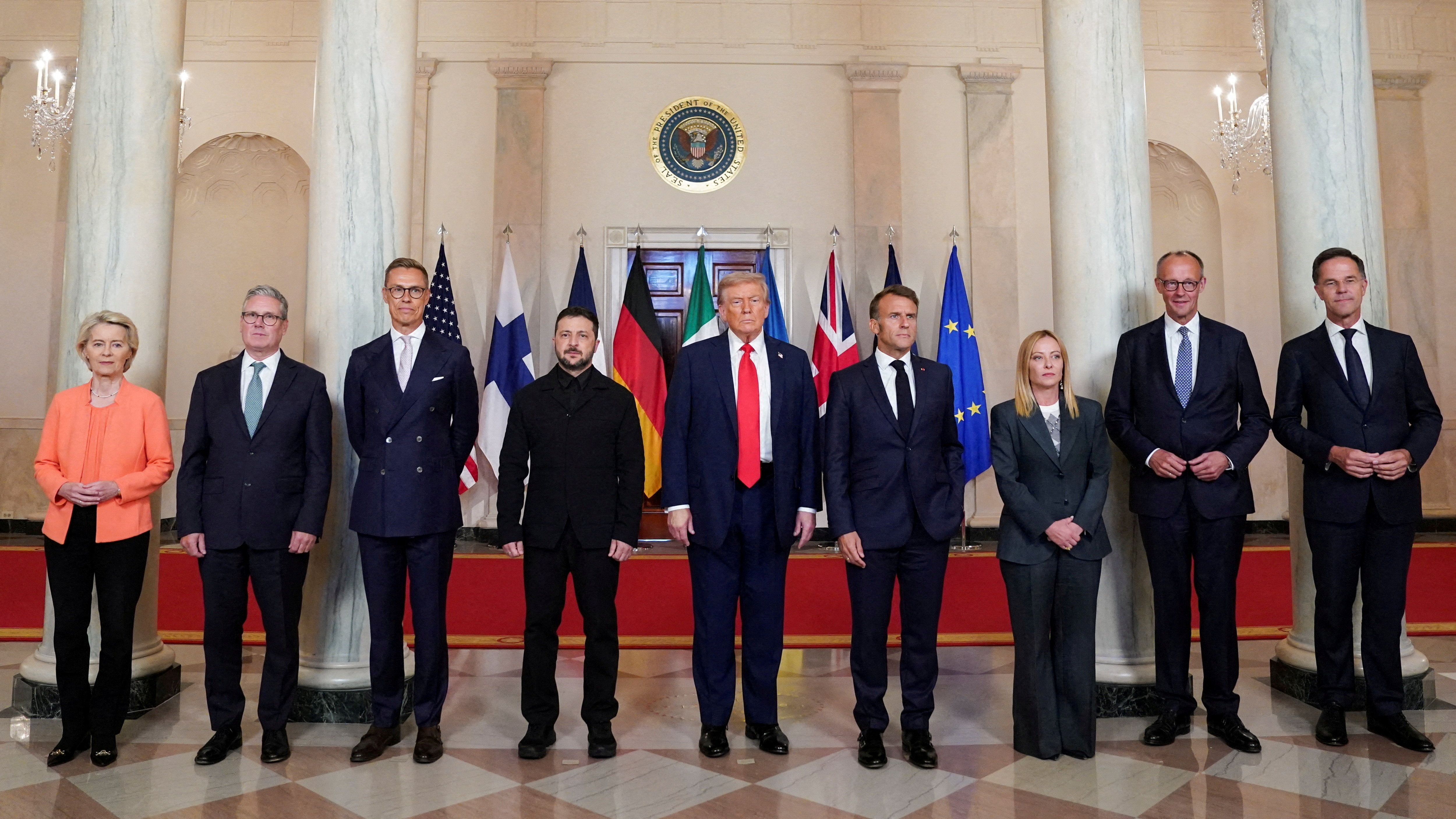 FILE PHOTO: U.S. President Donald Trump, Ukrainian President Volodymyr Zelenskiy, German Chancellor Friedrich Merz, French President Emmanuel Macron, British Prime Minister Keir Starmer, Italian Prime Minister Giorgia Meloni, and Finland's President Alexander Stubb, NATO Secretary General Mark Rutte and European Commission President Ursula von der Leyen pose for a family photo amid negotiations to end the Russian war in Ukraine, at the White House in Washington, D.C., U.S., August 18, 2025. REUTERS/Alexander Drago/File Photo