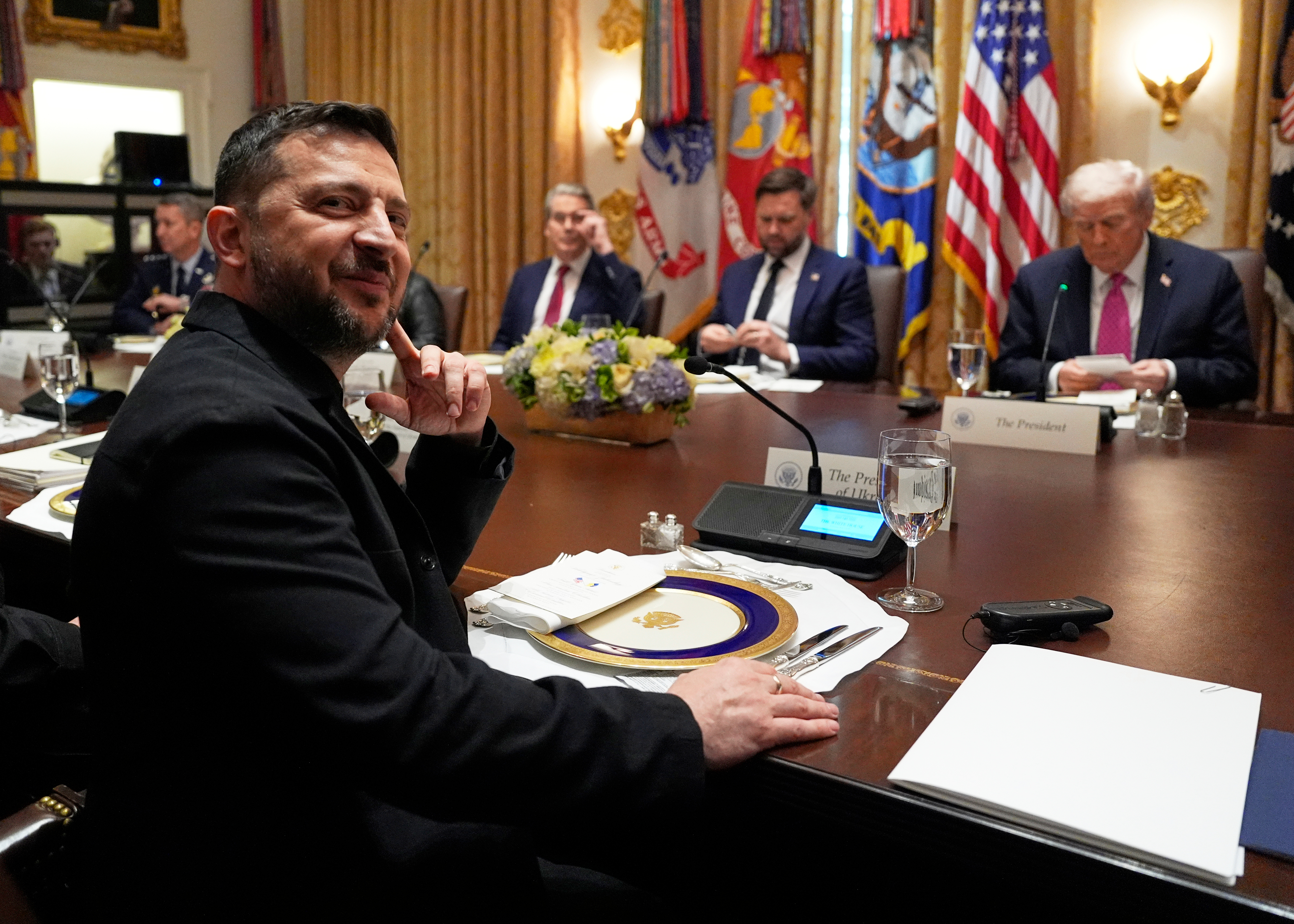 Ukraine's President Volodymyr Zelenskyy, left, sits before a meeting with President Donald Trump, from right, Vice President JD Vance and Treasury Secretary Scott Bessent in the Cabinet Room of the White House, Friday, Oct. 17, 2025, in Washington. (AP Photo/Alex Brandon)