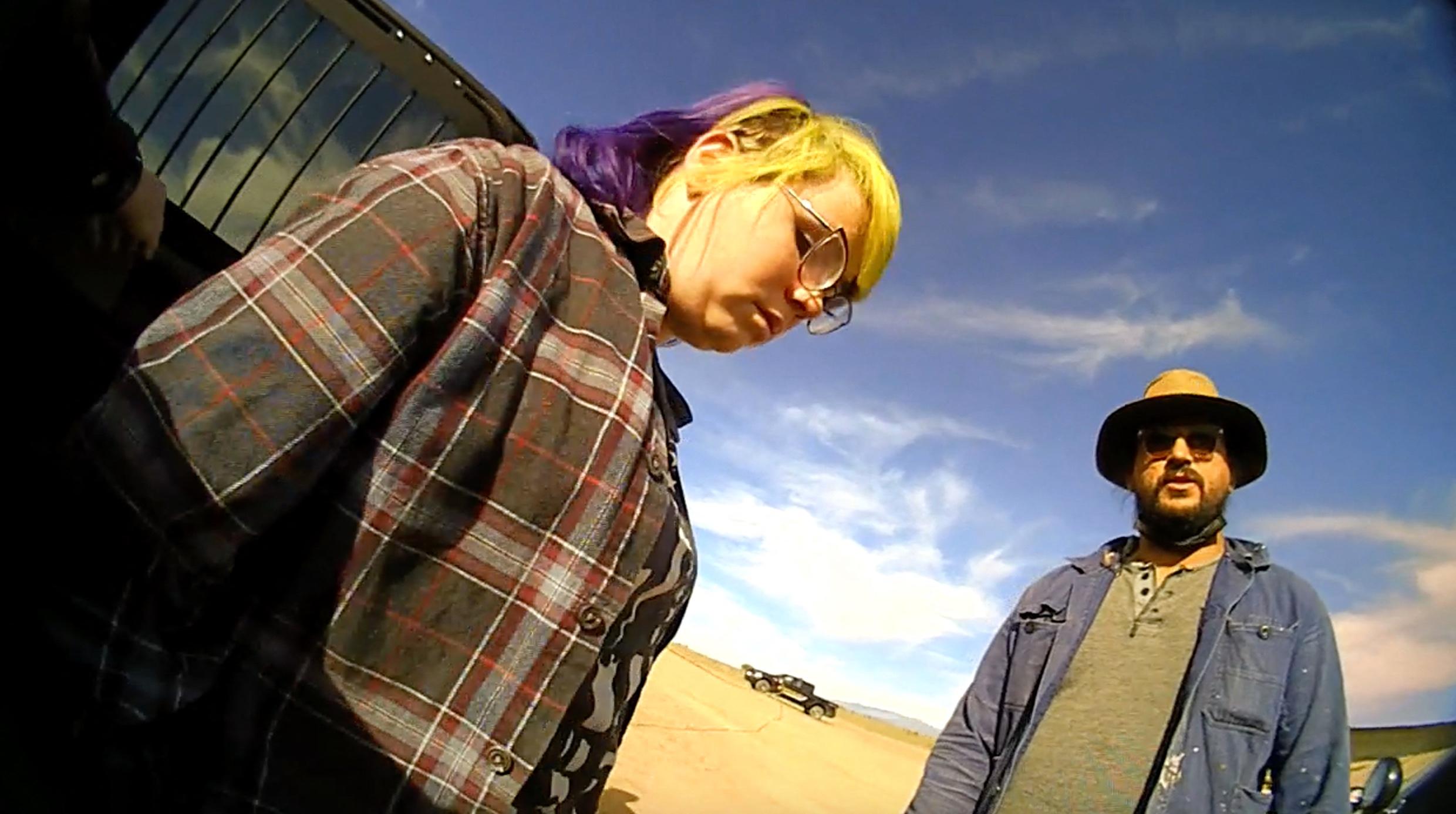 Hannah Gutierrez-Reed, the armourer on the set of Alec Baldwin movie Rust, where cinematographer Halyna Hutchins was shot dead, appears in police bodycam footage taken shortly after the fatal shooting in October 2021. She can be seen talking to police and can be heard telling an officer: “I just f****d up my whole entire career.” Bodycam footage captured on the New Mexico set shows Gutierrez-Reed sitting in the back of a police car before being escorted to a toilet by a female officer. The footage begins with Gutierrez-Reed answering a different officer’s questions. Gutierrez-Reed - who was in charge of weapons and ammunition on the set - first confirmed her place of work before responding to a question about her job title. When asked by a cop: “What’s your place of employment?” she responded, “Here”. The officer then asked: “What’s your job?” to which Gutierrez-Reed replied, “I’m the armourer, or at least I was.” Shortly afterwards, a female cop approaches the car Gutierrez-Reed is sitting in, saying: “Hi, you need to use the restroom?” Gutierrez-Reed confirms that she does, and the pair start walking across the film’s set towards the toilets. Gutierrez-Reed can be heard saying: “Welcome to the worst day of my life”, before adding: “I can’t believe Alec Baldwin was holding the gun, that’s so f****d.” Once in the bathroom, Gutierrez-Reed states: “I just want to get the f**k out of here and never show my face in this industry again. “I'm the only female armourer in the game and I just f****d up my whole entire career.