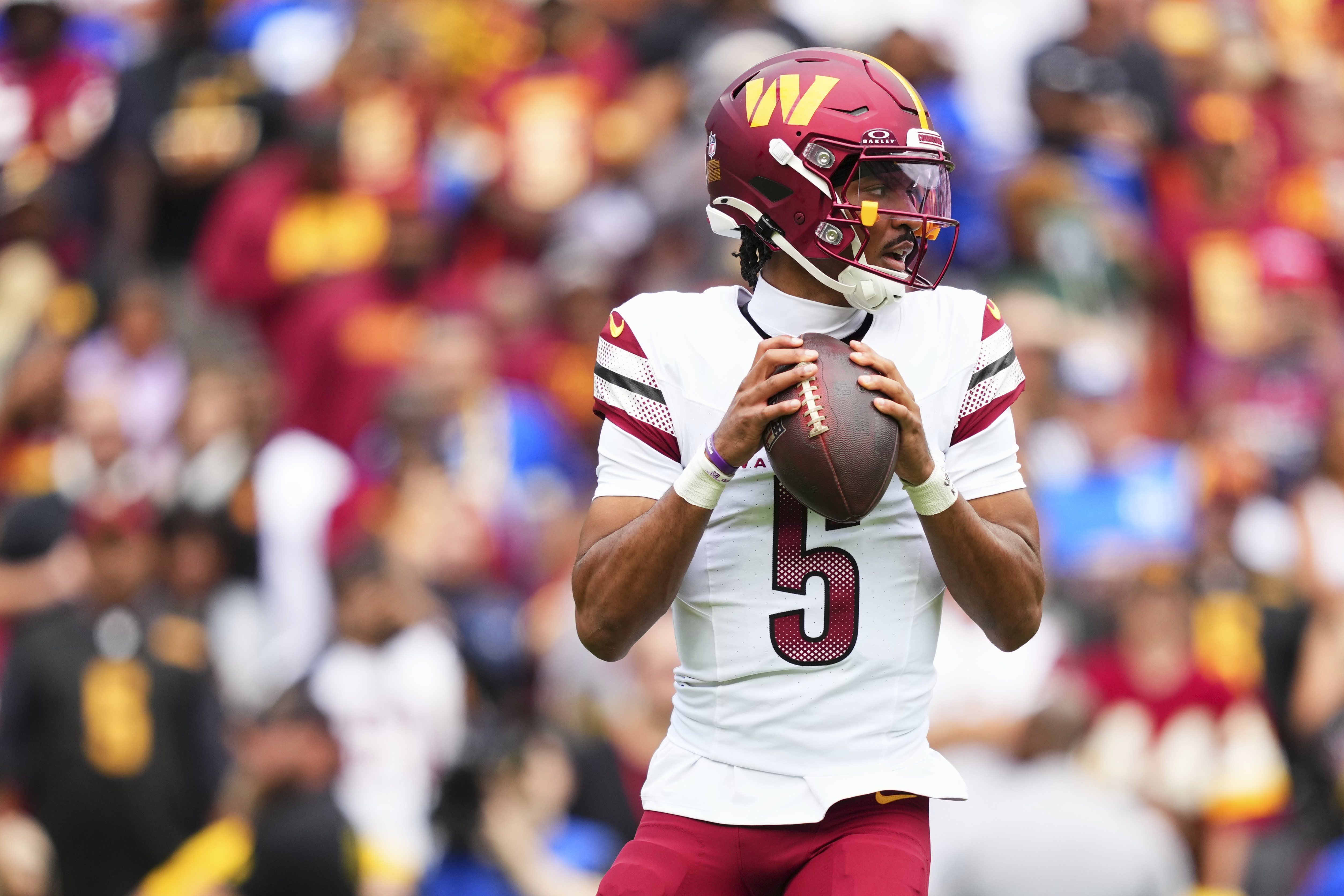 LANDOVER, MD - SEPTEMBER 07: Jayden Daniels #5 of the Washington Commanders drops back to pass against the New York Giants during an NFL football game at Northwest Stadium on September 7, 2025 in Landover, Maryland. (Photo by Cooper Neill/Getty Images)
