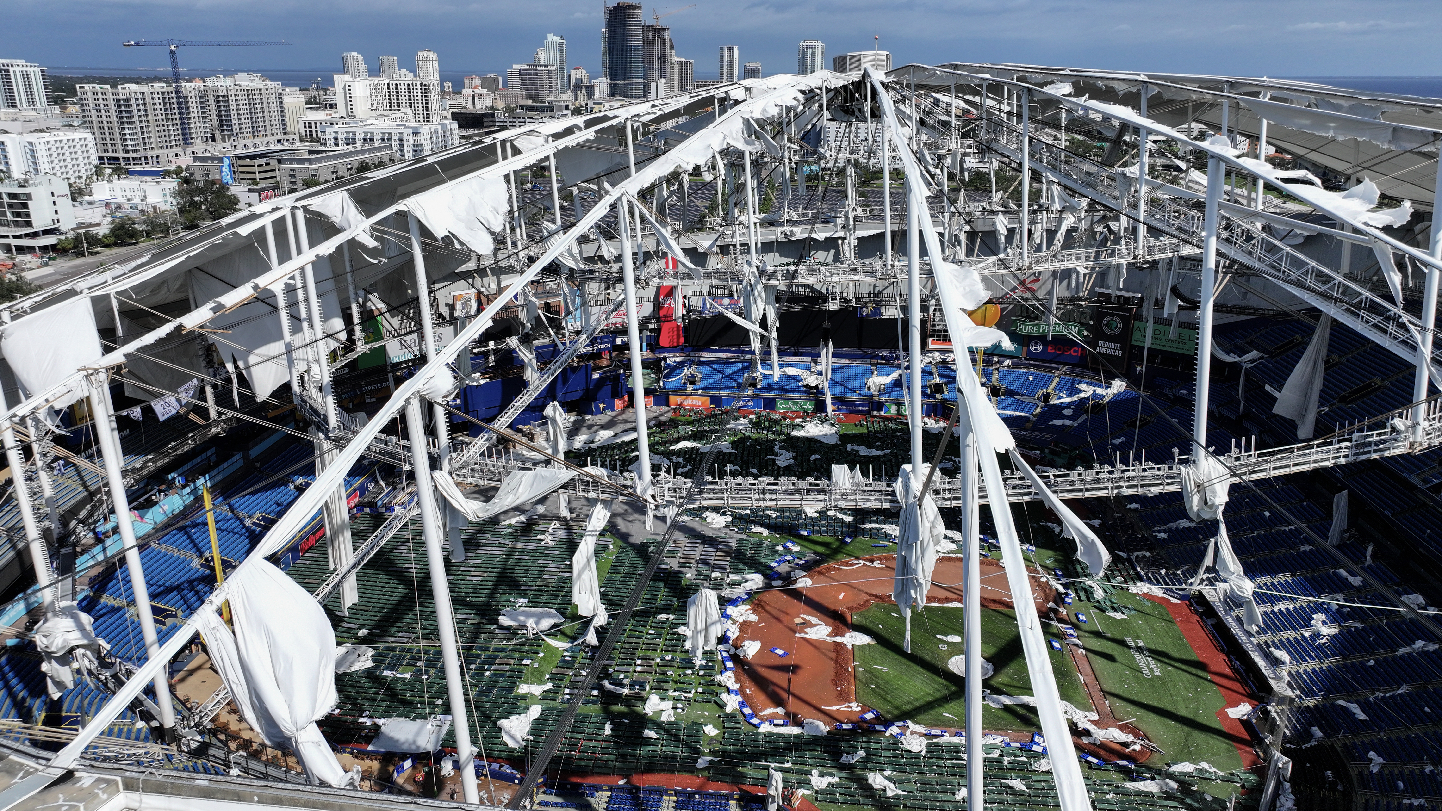 ST PETERSBURG - OCTOBER 10: In this aerial view, the roof of Tropicana Field is seen in tatters after Hurricane Milton destroyed it as the storm passed through the area on October 10, 2024, in St. Petersburg, Florida. The storm made landfall as a Category 3 hurricane in the Siesta Key area of Florida, causing damage and flooding throughout Central Florida. (Photo by Joe Raedle/Getty Images)