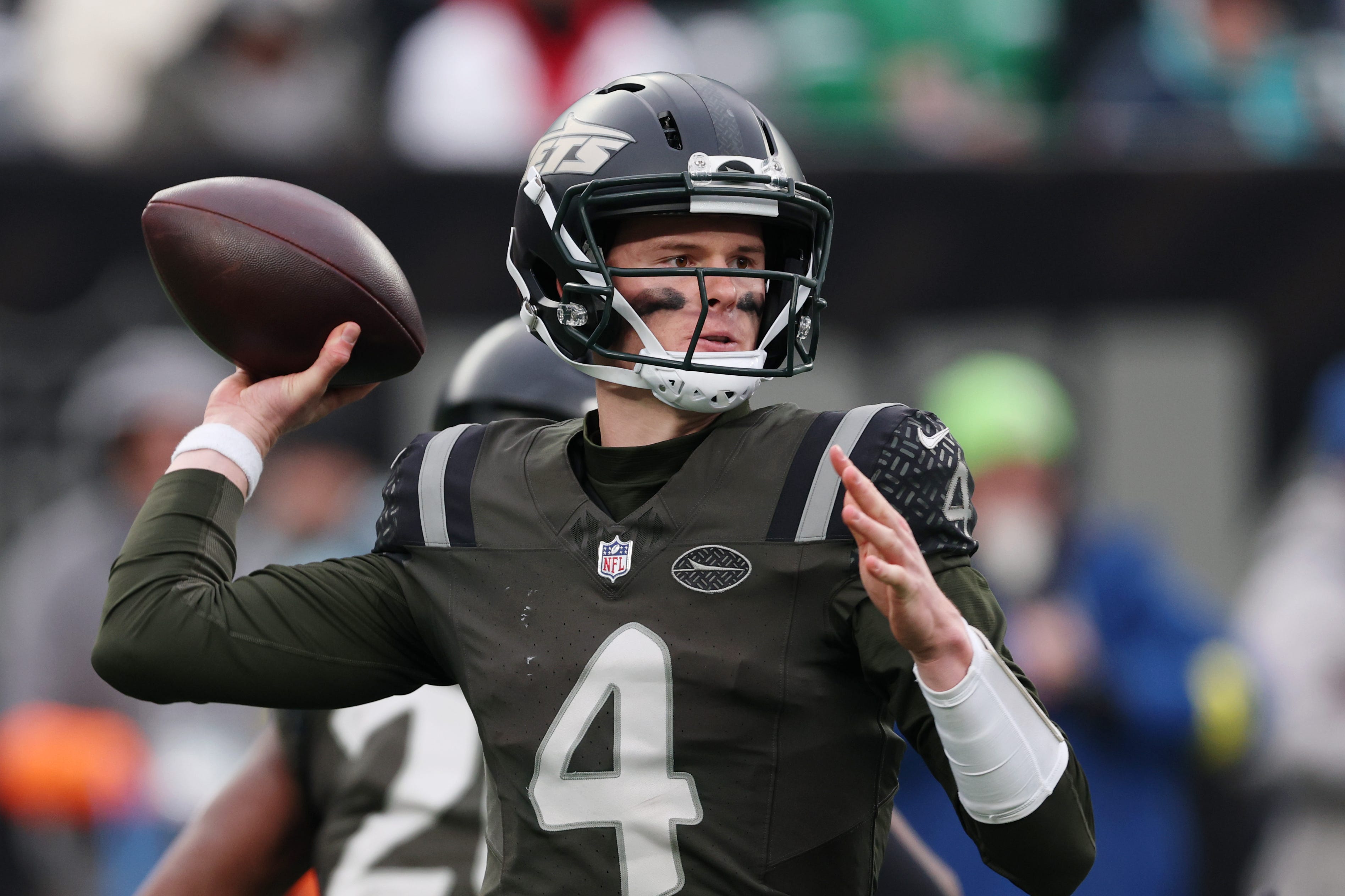 Dec 7, 2025; East Rutherford, New Jersey, USA; New York Jets quarterback Brady Cook (4) passes the ball against the Miami Dolphins during the second half at MetLife Stadium. Mandatory Credit: Vincent Carchietta-Imagn Images