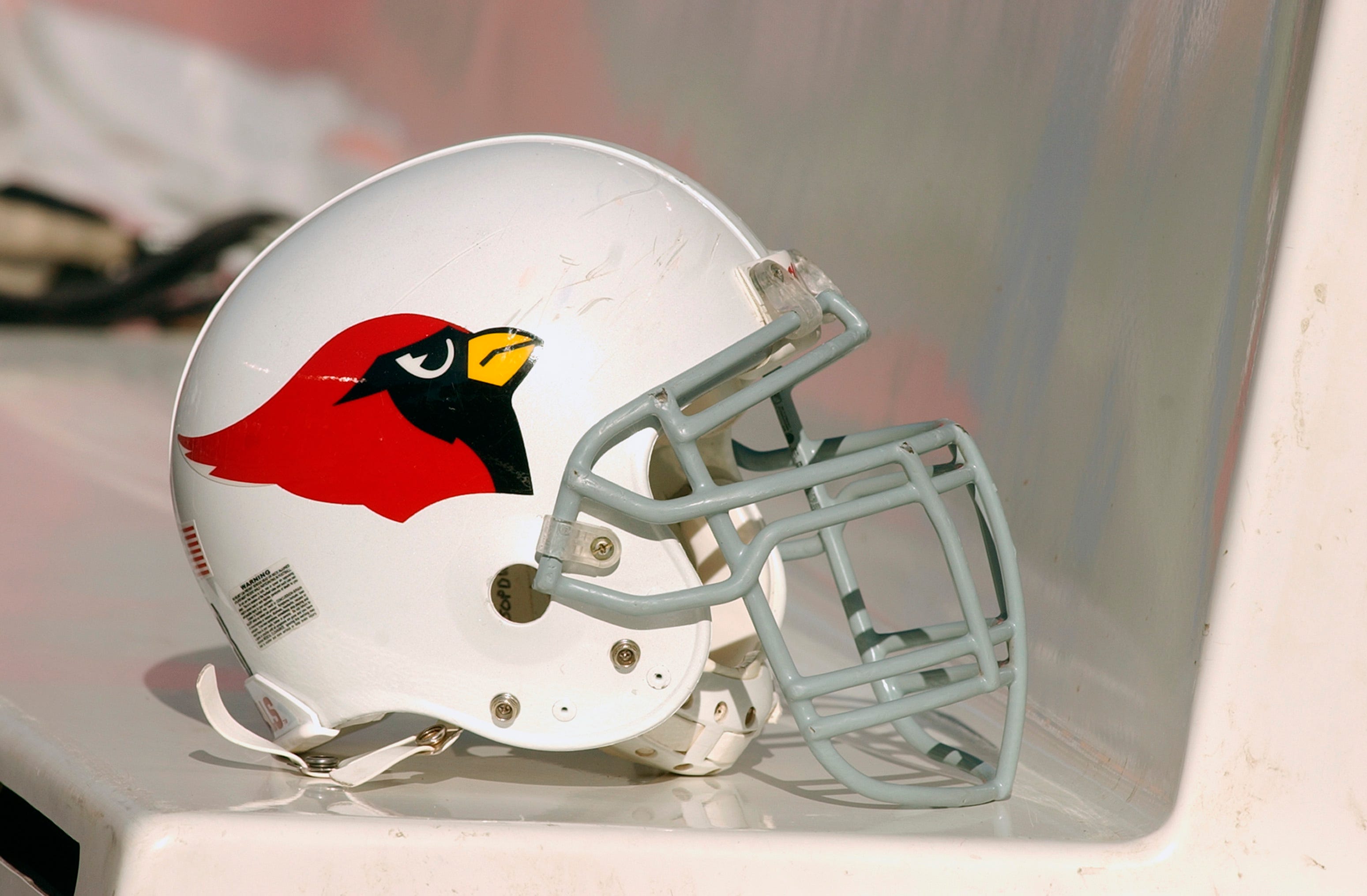 The helmet of the Arizona Cardinals sits on their team bench during the game against the Chicago Bears on November 30, 2003 at Soldier Field in Chicago, Illinois.