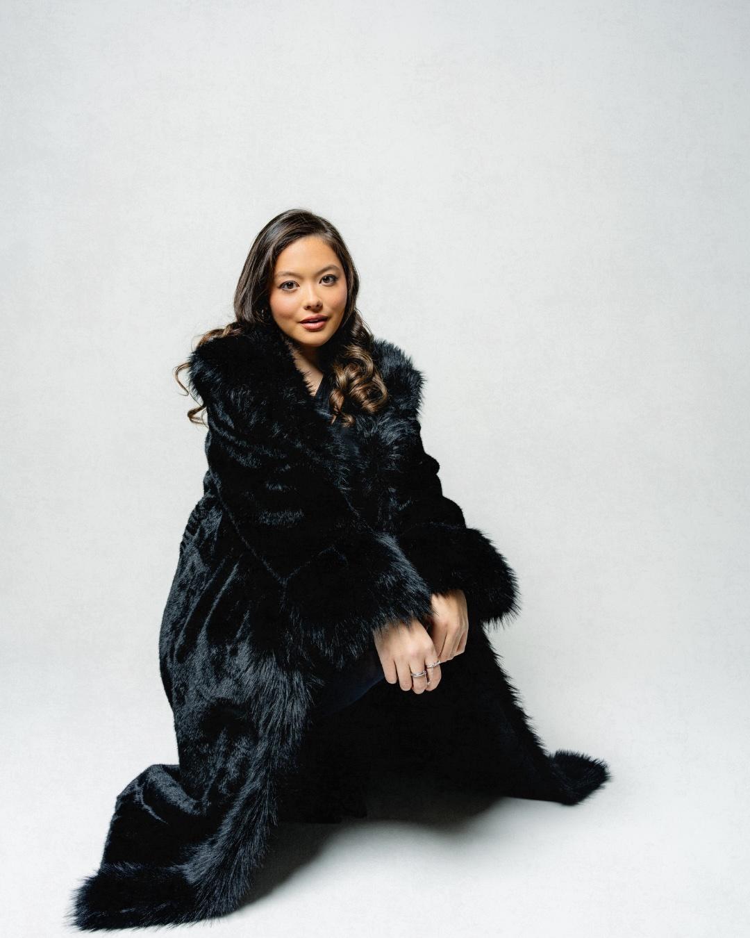 Kristi Cook sitting on ground