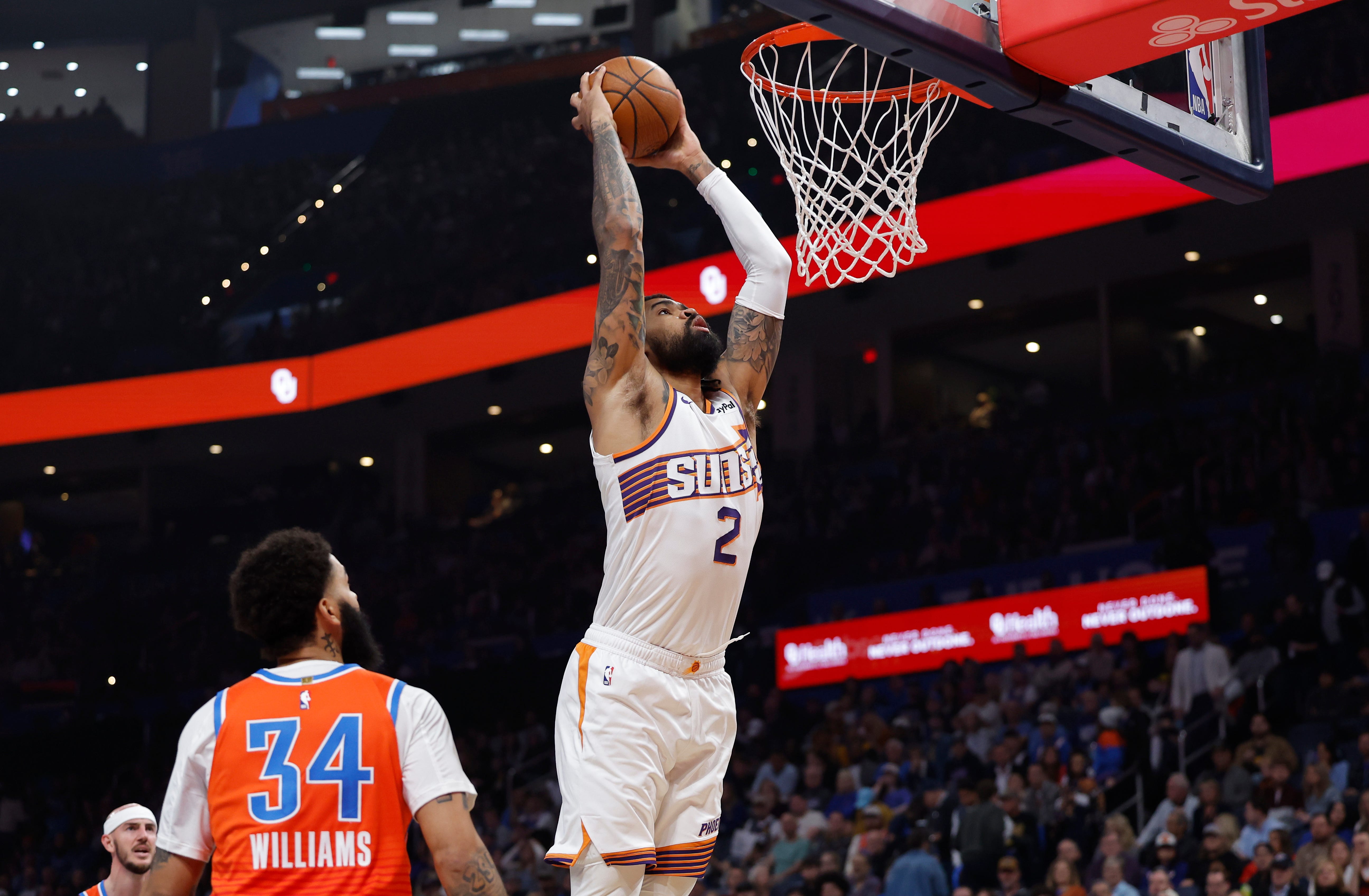Nov 28, 2025; Oklahoma City, Oklahoma, USA; Phoenix Suns center Nick Richards (2) goes up for a dunk against the Oklahoma City Thunder during the second quarter at Paycom Center. Mandatory Credit: Alonzo Adams-Imagn Images