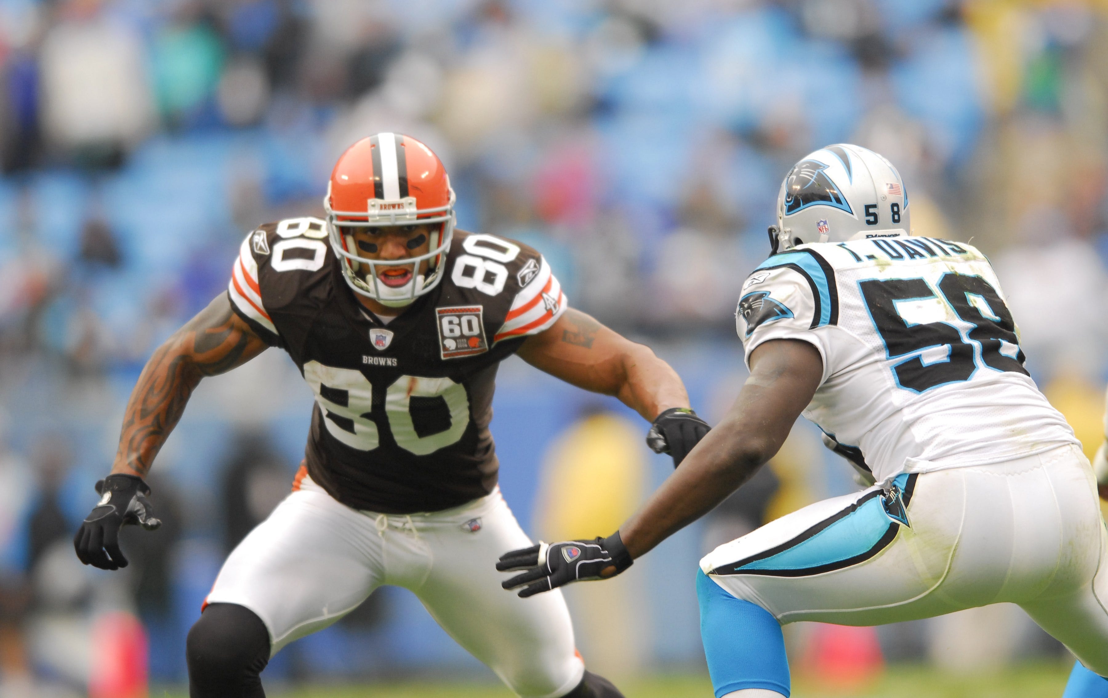 Tight end Kellen Winslow of the Cleveland Browns evades linebacker Thomas Davis of the Carolina Panthers.