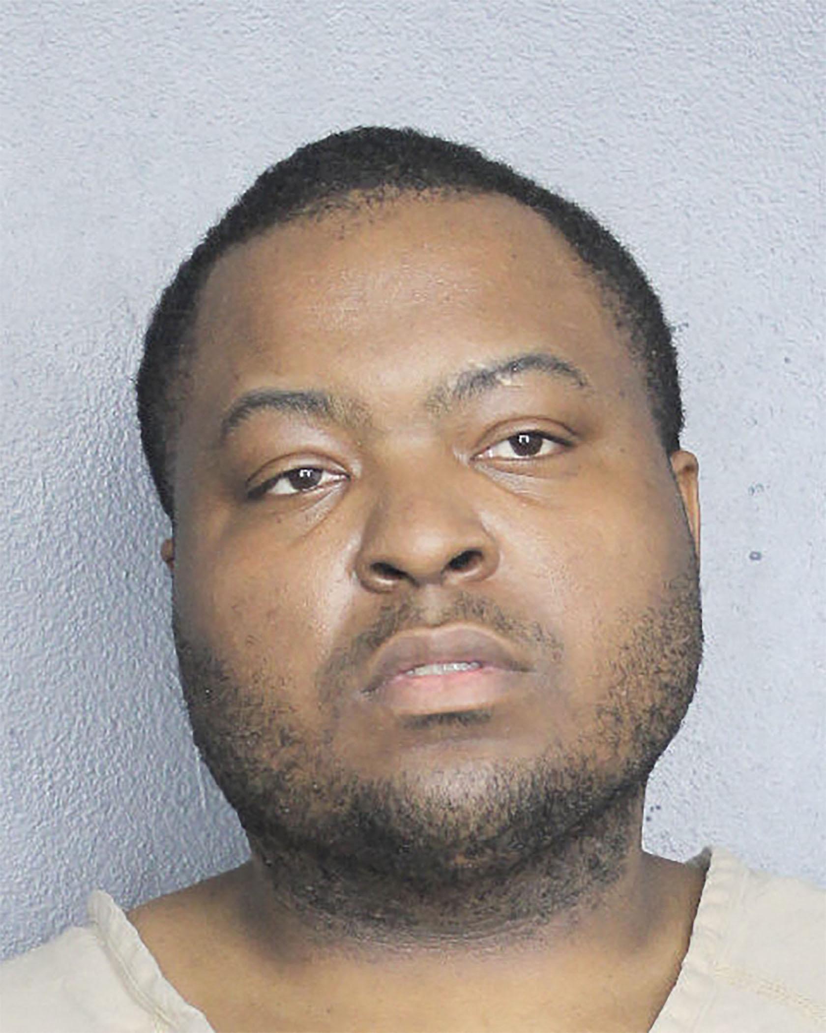 Sean Kingston looks glum on his mugshot as he is booked into Florida jail
