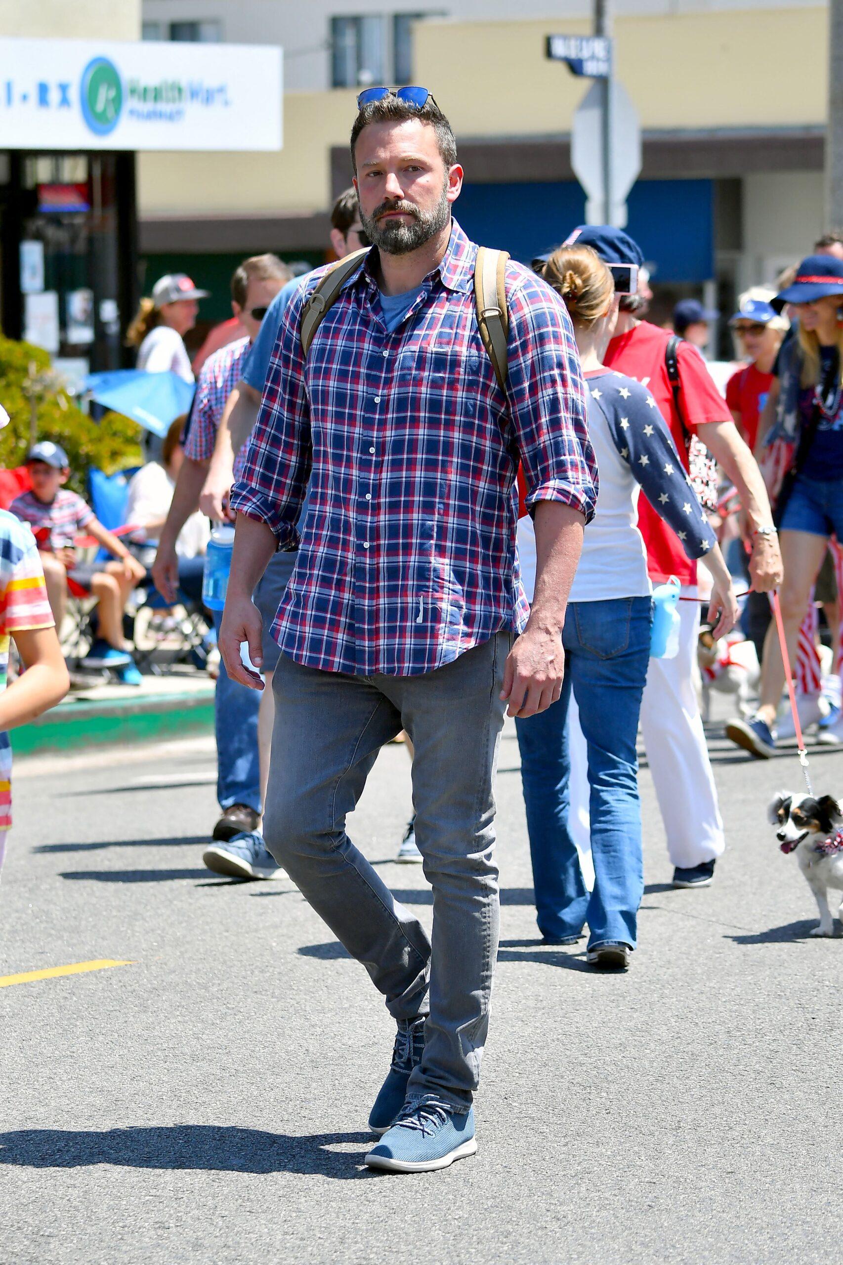 Ben Affleck is joined by two of his kids as he walks the Pacific Palisades 4th of July parade with their dogs