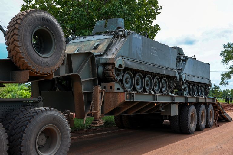 A truck carries armoured personnel carriers (APC) on a road near Thailand-Cambodia's border in Sisaket province, the day after the leaders of Cambodia and Thailand agreed to a ceasefire on Monday in a bid to bring an end to their deadliest conflict in more than a decade and ahead of military negotiations, Thailand, July 29, 2025. REUTERS/Athit Perawongmetha
