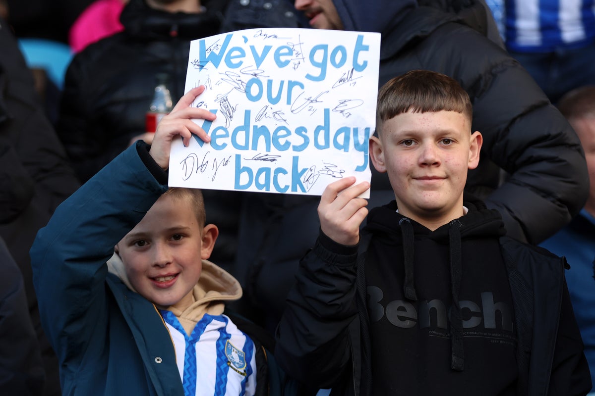 Young Sheffield Wednesday fans celebrate the departure of owner Dejphon Chansiri (Getty Images)