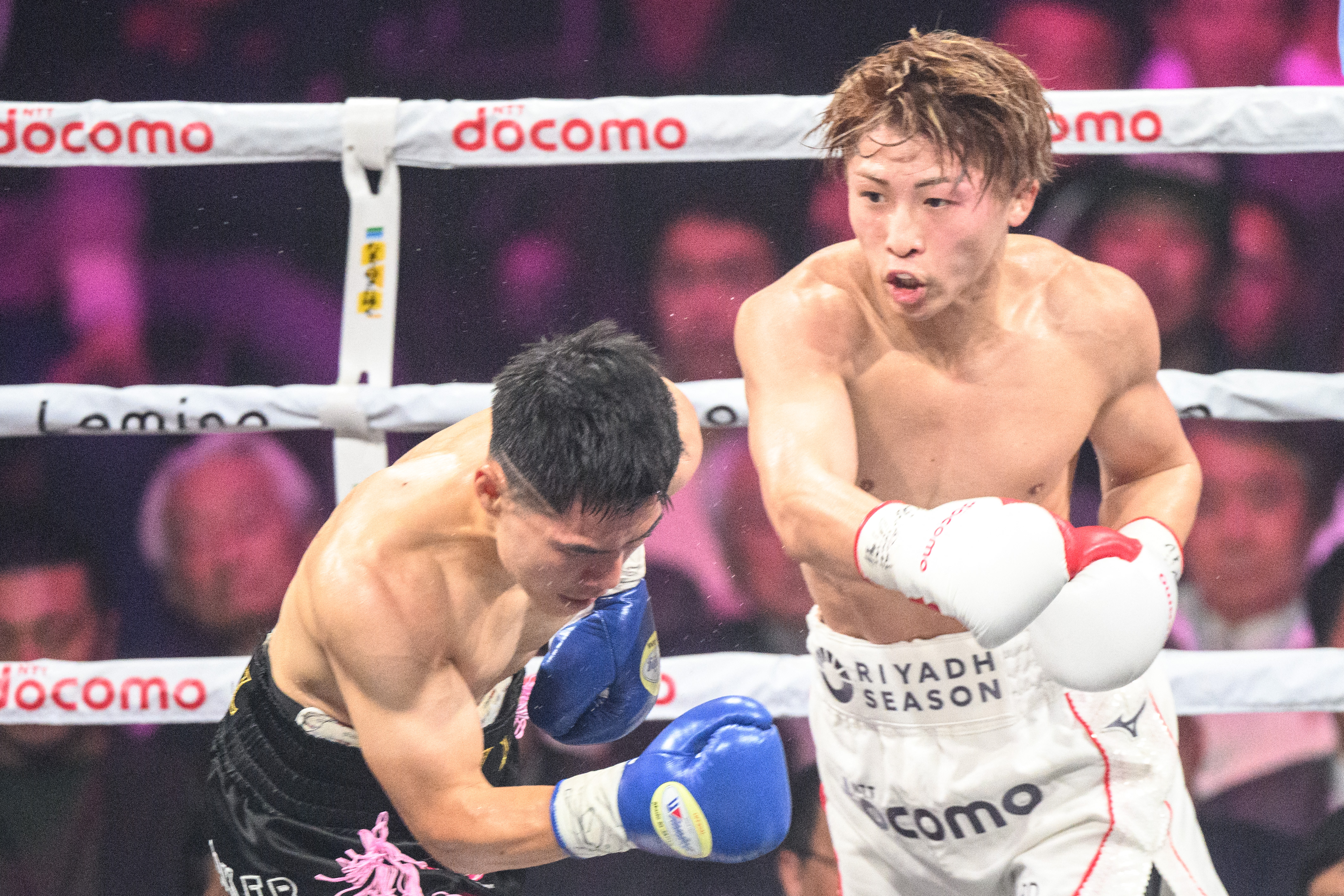 Japan's Naoya Inoue (R) fights against South Korea's Kim Ye-joon during their world super-bantamweight title boxing bout in Tokyo on January 24, 2025. (Photo by Philip FONG / AFP) (Photo by PHILIP FONG/AFP via Getty Images)