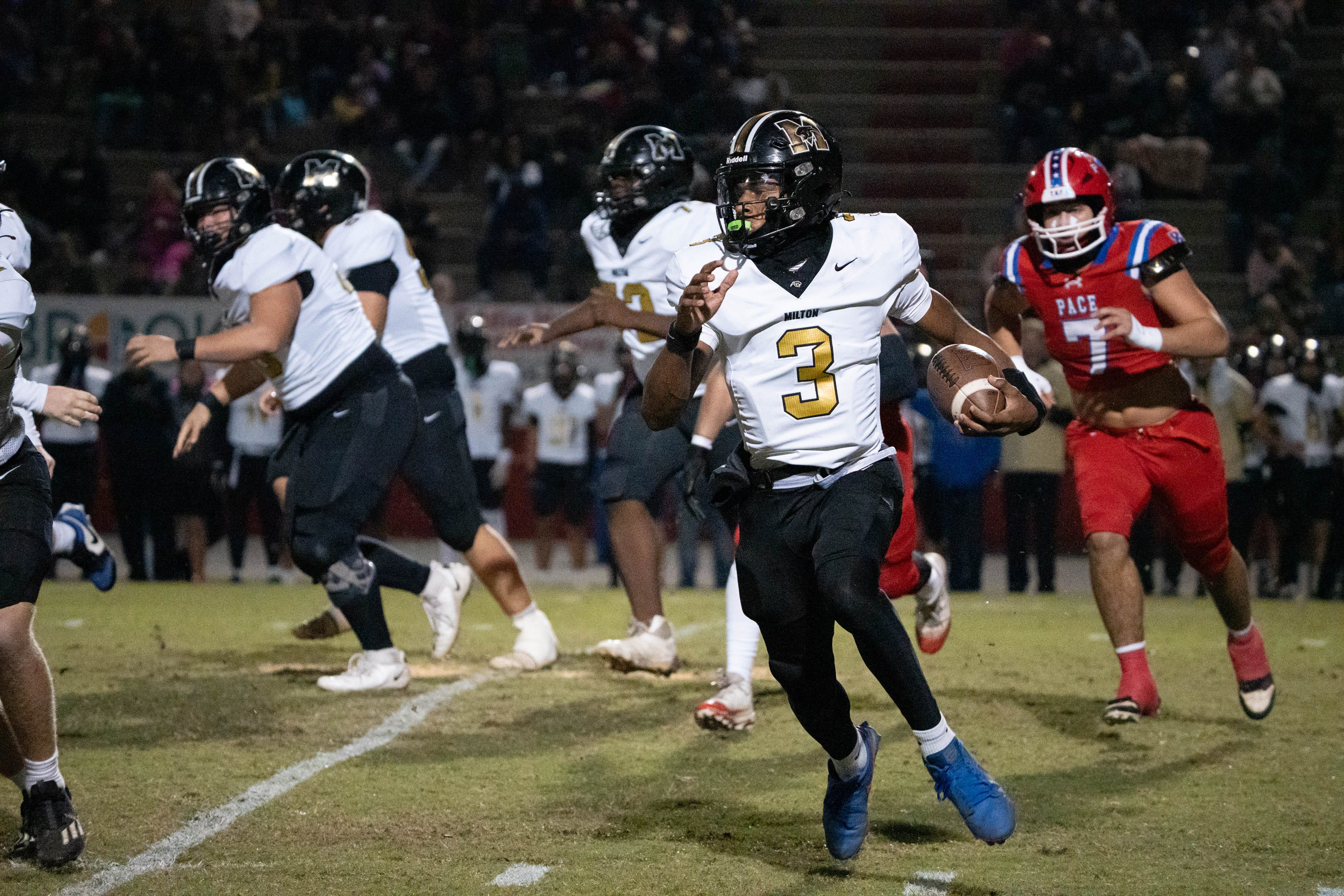 Panthers quarterback Kaiden Hall (3) keeps the ball during the Milton vs Pace football game at Pace High School on Oct. 31, 2025.