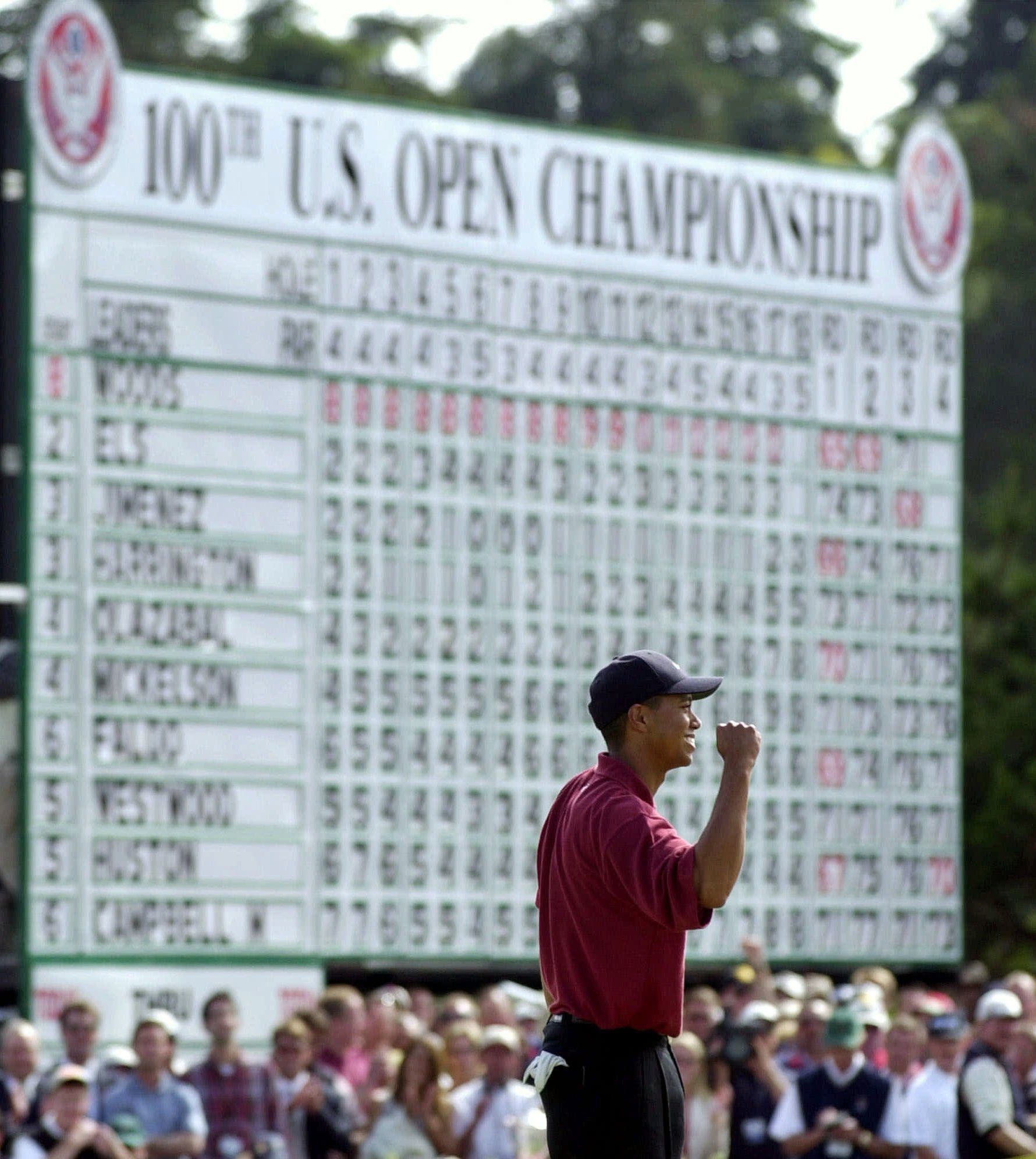 Tiger Woods celebrates on the 18th green after winning the 100th U.S. Open at the Pebble Beach Golf Links in Pebble Beach, California.