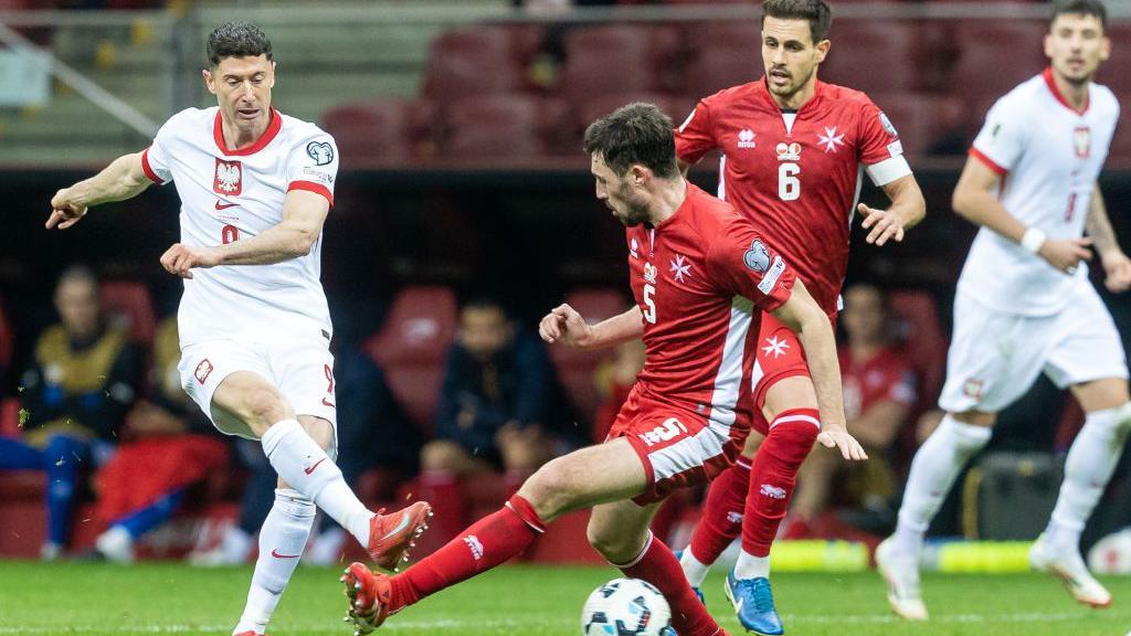 James Carragher in action for Malta against Poland