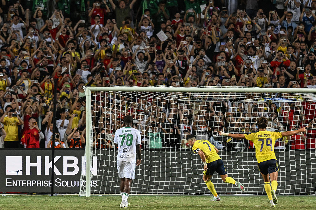 Al-Nassr's Cristiano Ronaldo (C) celebrates after scoring his team's first goal during the Saudi Super Cup final football match between Al-Nassr and Al-Ahli at the Hong Kong Stadium in Hong Kong on August 23, 2025. (Photo by Wun Suen / AFP) (Photo by WUN SUEN/AFP via Getty Images)